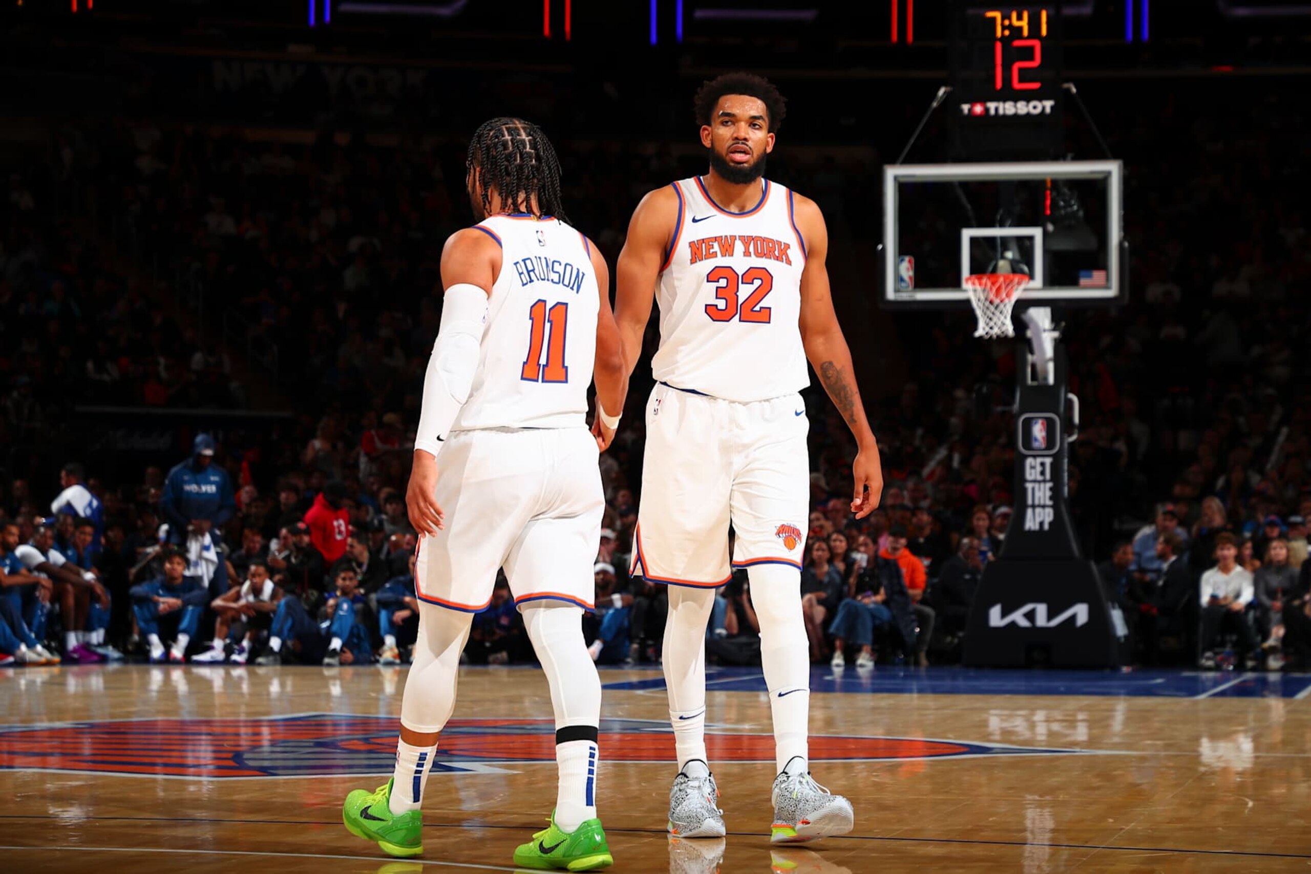 NEW YORK, NY - OCTOBER 13: Karl-Anthony Towns #32 of the New York Knicks high-fives teammate Jalen Brunson #11 during the game on October 13, 2024 at Madison Square Garden in New York City, New York.  NOTE TO USER: User expressly acknowledges and agrees that, by downloading and or using this photograph, User is consenting to the terms and conditions of the Getty Images License Agreement. Mandatory Copyright Notice: Copyright 2024 NBAE  (Photo by David L. Nemec/NBAE via Getty Images)