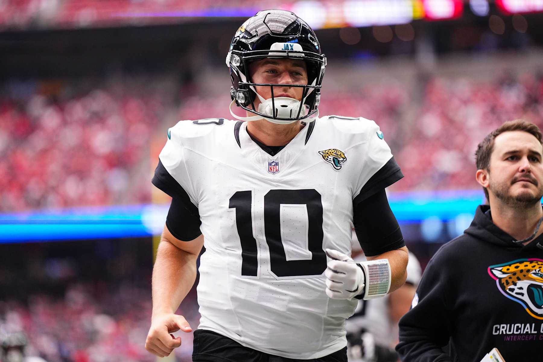 HOUSTON, TX - SEPTEMBER 29: Mac Jones #10 of the Jacksonville Jaguars walks off of the field during an NFL football game against the Houston Texans at NRG Stadium on September 29, 2024 in Houston, Texas. (Photo by Cooper Neill/Getty Images)