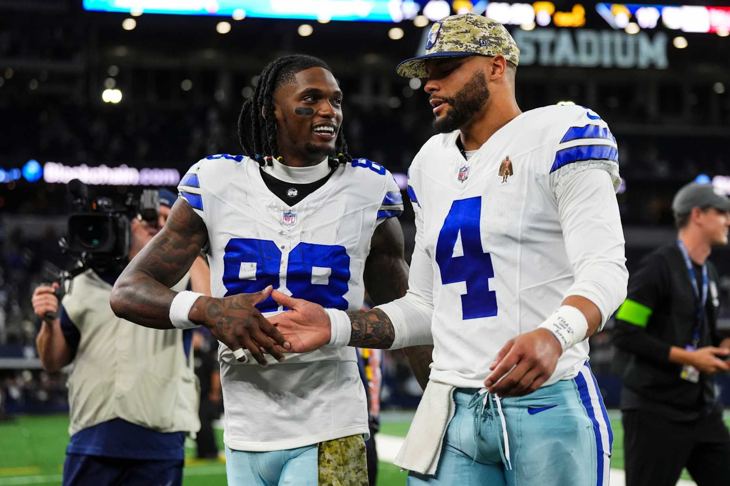 ARLINGTON, TX - NOVEMBER 12: Dak Prescott #4 of the Dallas Cowboys talks with CeeDee Lamb #88 after an NFL football game against the New York Giants at AT&T Stadium on November 12, 2023 in Arlington, Texas. (Photo by Cooper Neill/Getty Images)