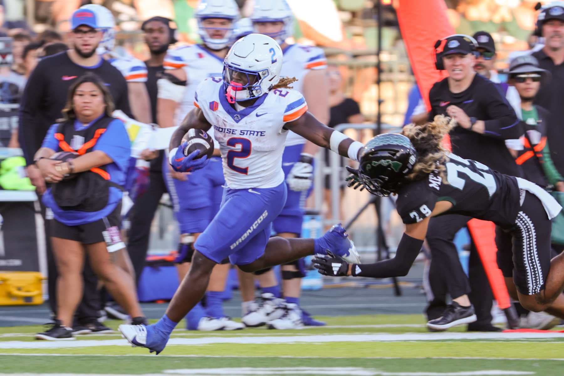 HONOLULU, HI - OCTOBER 12: Ashton Jeanty #2 of the Boise State Broncos stiff-arms Kilinahe Mendiola-Jensen #29 of the Hawaii Rainbow Warriors during the first half of the game at the Clarence T.C. Ching Athletics Complex on October 12, 2024 in Honolulu, Hawaii. (Photo by Darryl Oumi/Getty Images)