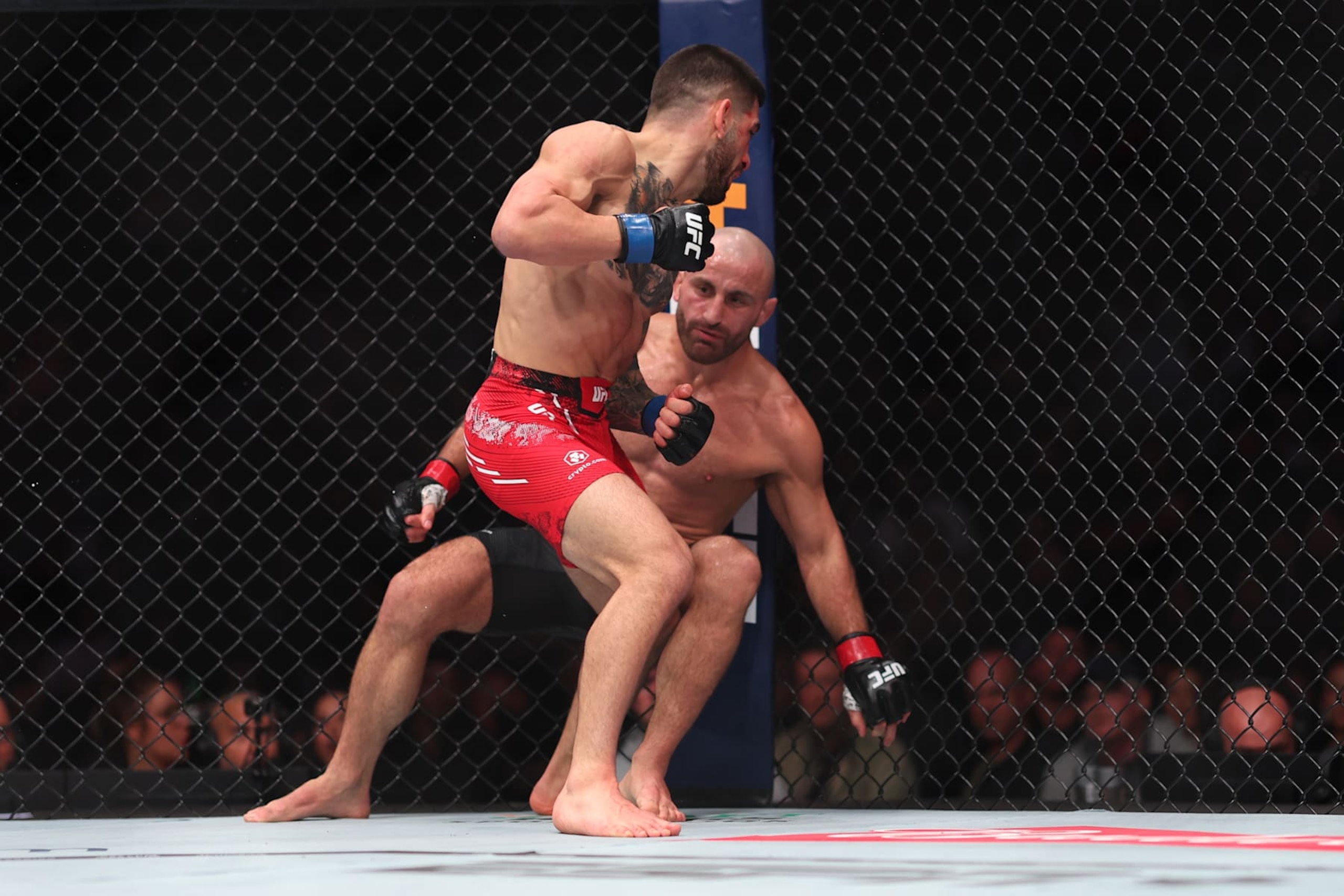 ANAHEIM, CALIFORNIA - FEBRUARY 17: Ilia Topuria  knocks out Alexander Volkanovski of Australia in their featherweight title fight during UFC 298 at Honda Center on February 17, 2024 in Anaheim, California. (Photo by Sean M. Haffey/Getty Images)
