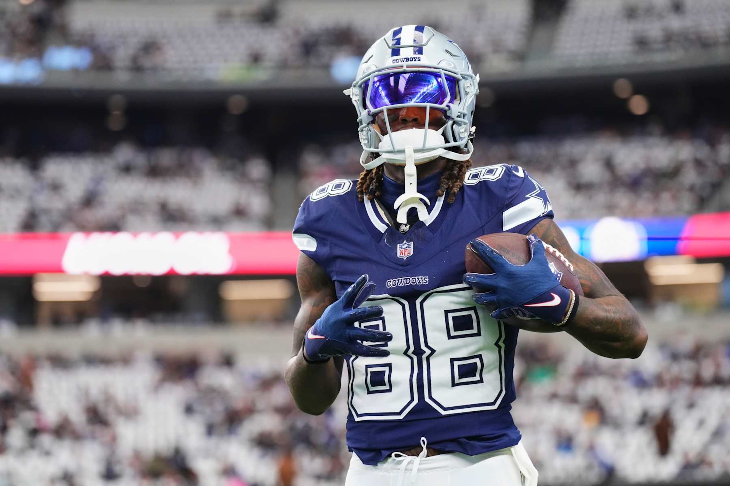 ARLINGTON, TX - OCTOBER 13: CeeDee Lamb #88 of the Dallas Cowboys warms up before kickoff against the Detroit Lions during an NFL football game at AT&T Stadium on October 13, 2024 in Arlington, Texas. (Photo by Cooper Neill/Getty Images)
