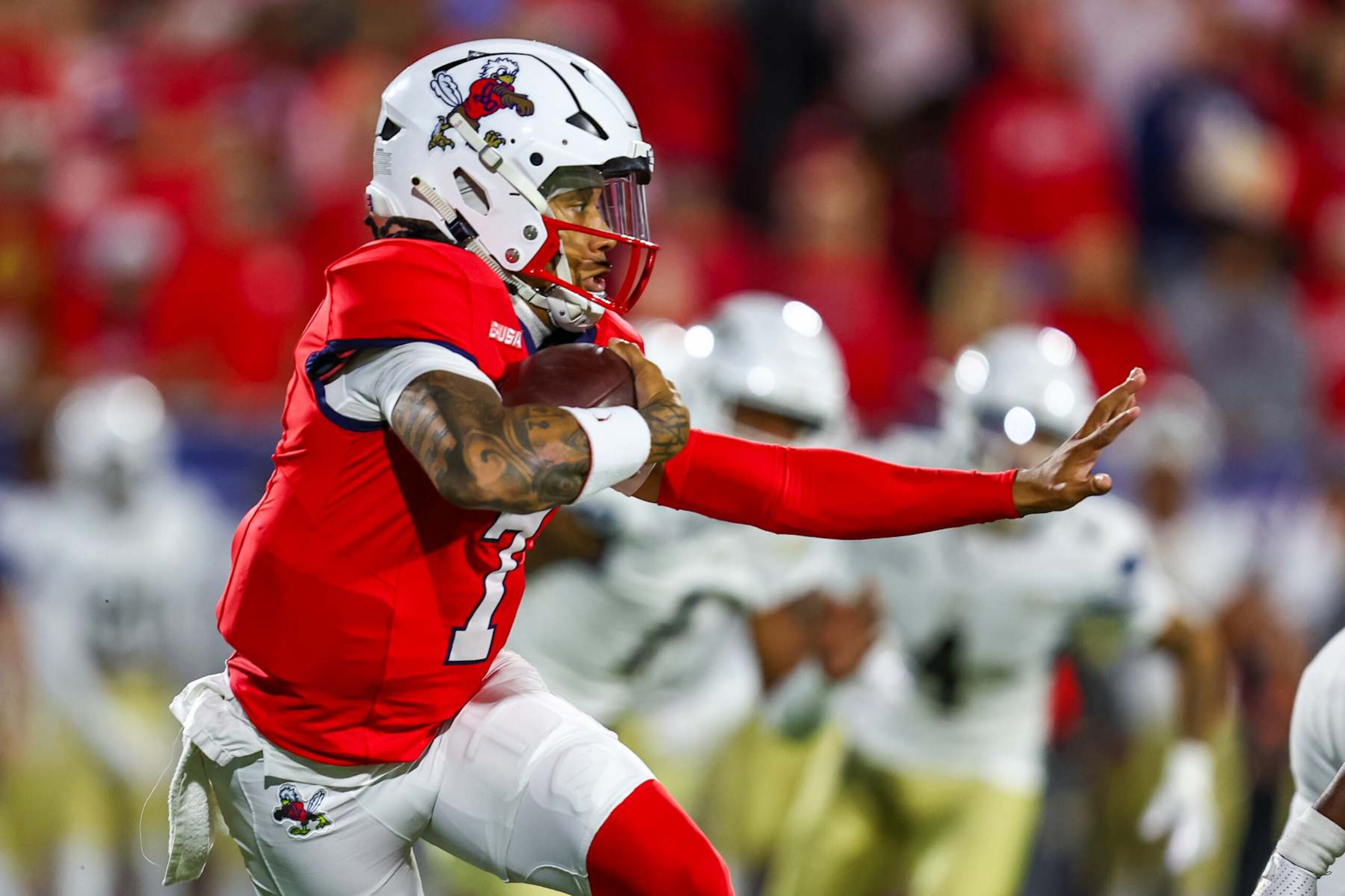 LYNCHBURG, VIRGINIA - OCTOBER 08: Kaidon Salter #7 of the Liberty Flames runs the ball during the first half of a football game against the Florida International University Panthers at Williams Stadium on October 08, 2024 in Lynchburg, Virginia.  (Photo by David Jensen/Getty Images)