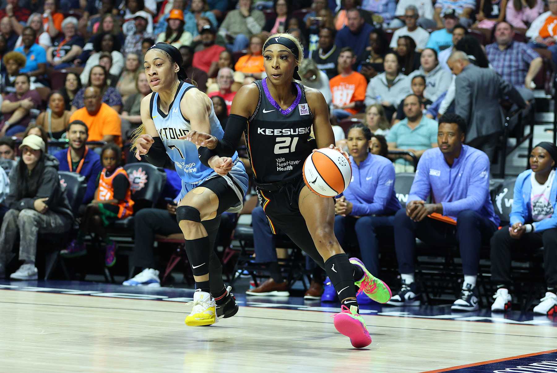 UNCASVILLE, CT - AUGUST 23: Connecticut Sun guard DiJonai Carrington (21) defended by Chicago Sky guard Chennedy Carter (7) during a WNBA game between Chicago Sky and Connecticut Sun on August 23, 2024, at Mohegan Sun Arena in Uncasville, CT. (Photo by M. Anthony Nesmith/Icon Sportswire via Getty Images)