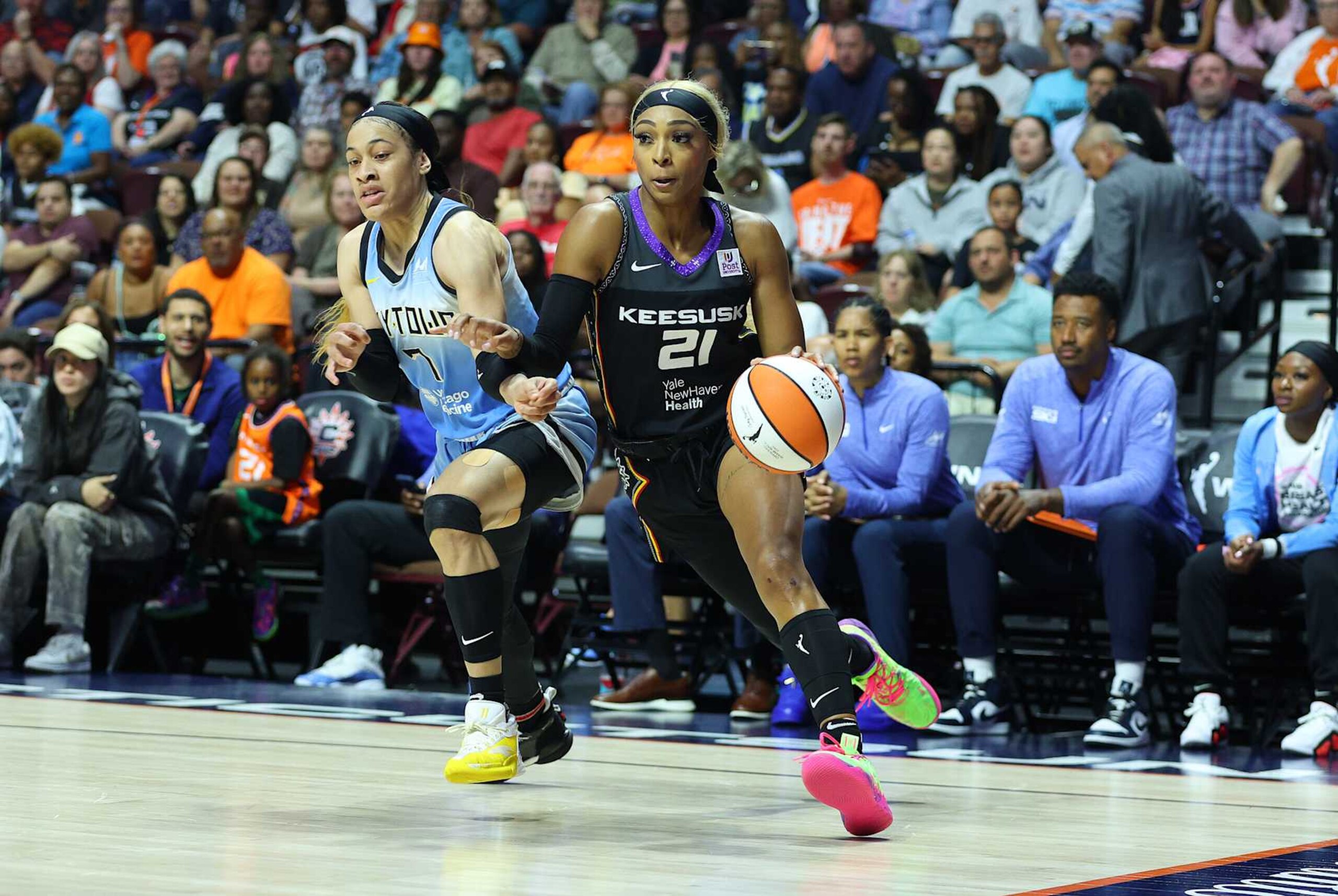 UNCASVILLE, CT - AUGUST 23: Connecticut Sun guard DiJonai Carrington (21) defended by Chicago Sky guard Chennedy Carter (7) during a WNBA game between Chicago Sky and Connecticut Sun on August 23, 2024, at Mohegan Sun Arena in Uncasville, CT. (Photo by M. Anthony Nesmith/Icon Sportswire via Getty Images)