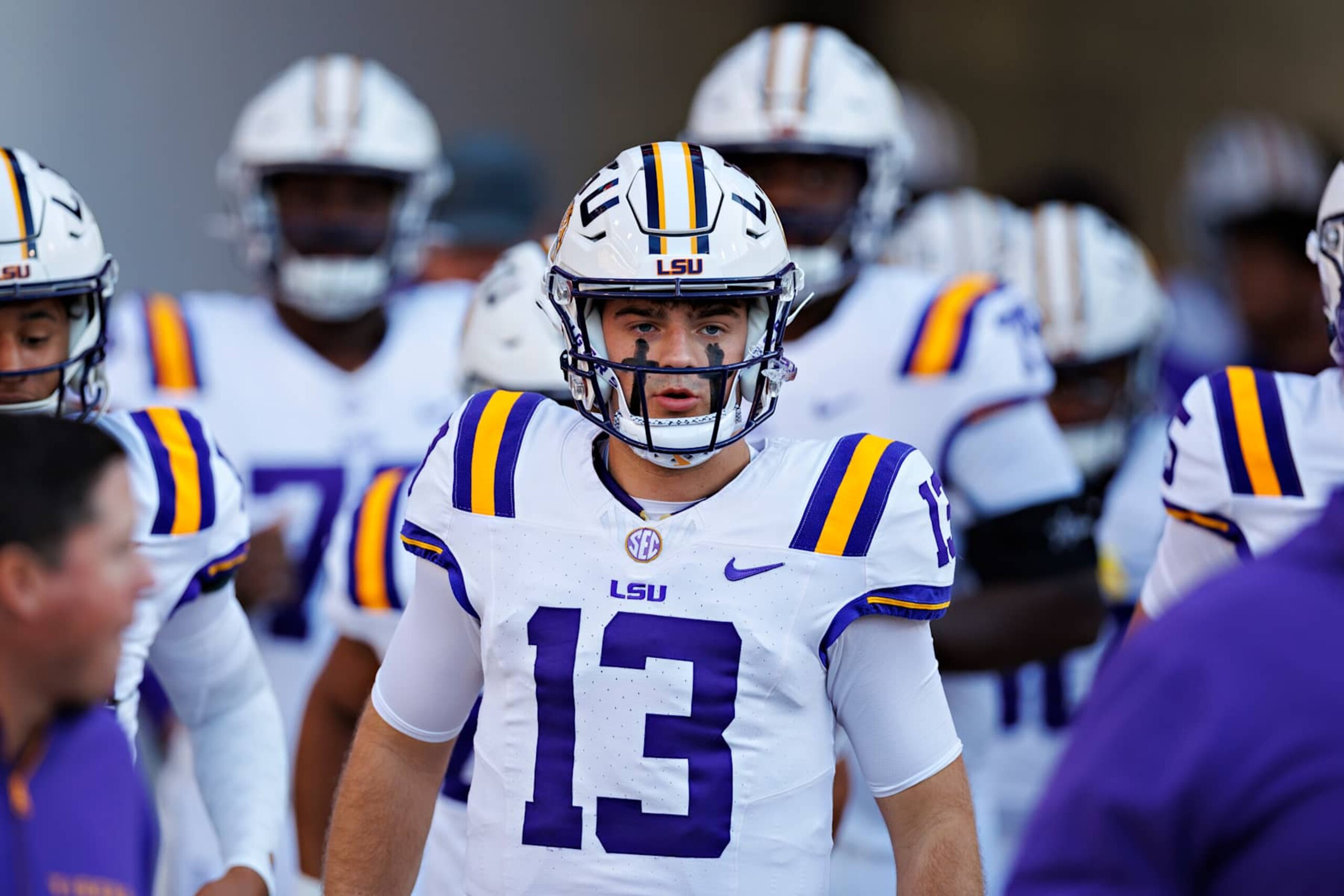 FAYETTEVILLE, ARKANSAS - OCTOBER 19: Garrett Nussmeier #13 of the LSU Tigers leads the team onto the field before the game against the Arkansas Razorbacks at Donald W. Reynolds Razorback Stadium on October 19, 2024 in Fayetteville, Arkansas. (Photo by Wesley Hitt/Getty Images)