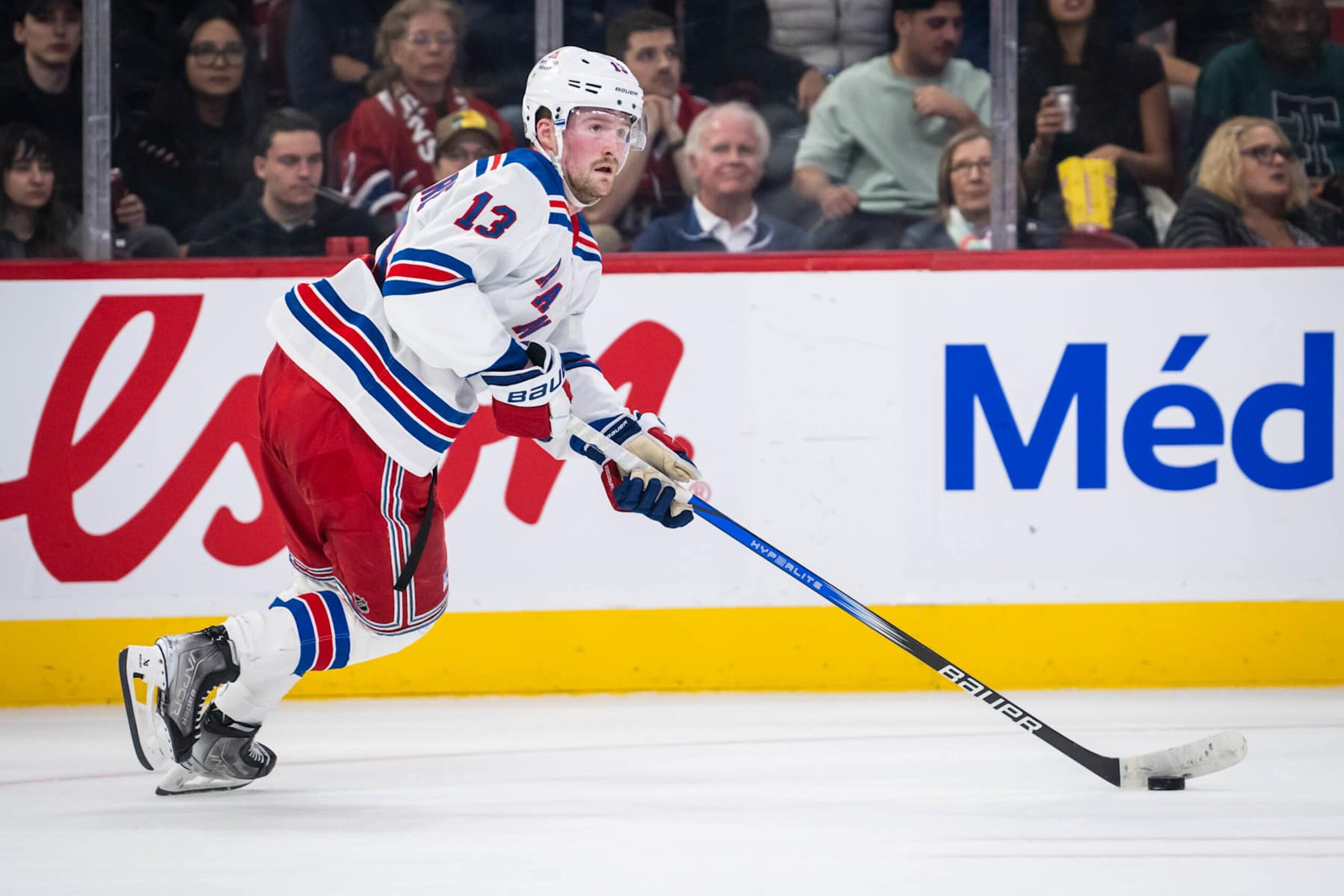 MONTREAL, QC - OCTOBER 22:  Alexis Lafrenière (13) of the New York Rangers  skates with the puck during the second period of the NHL  game between the New York Rangers and the Montreal Canadiens on Oct 22, 2024, at the Bell Centre in Montreal, QC(Photo by Vincent Ethier/Icon Sportswire via Getty Images)