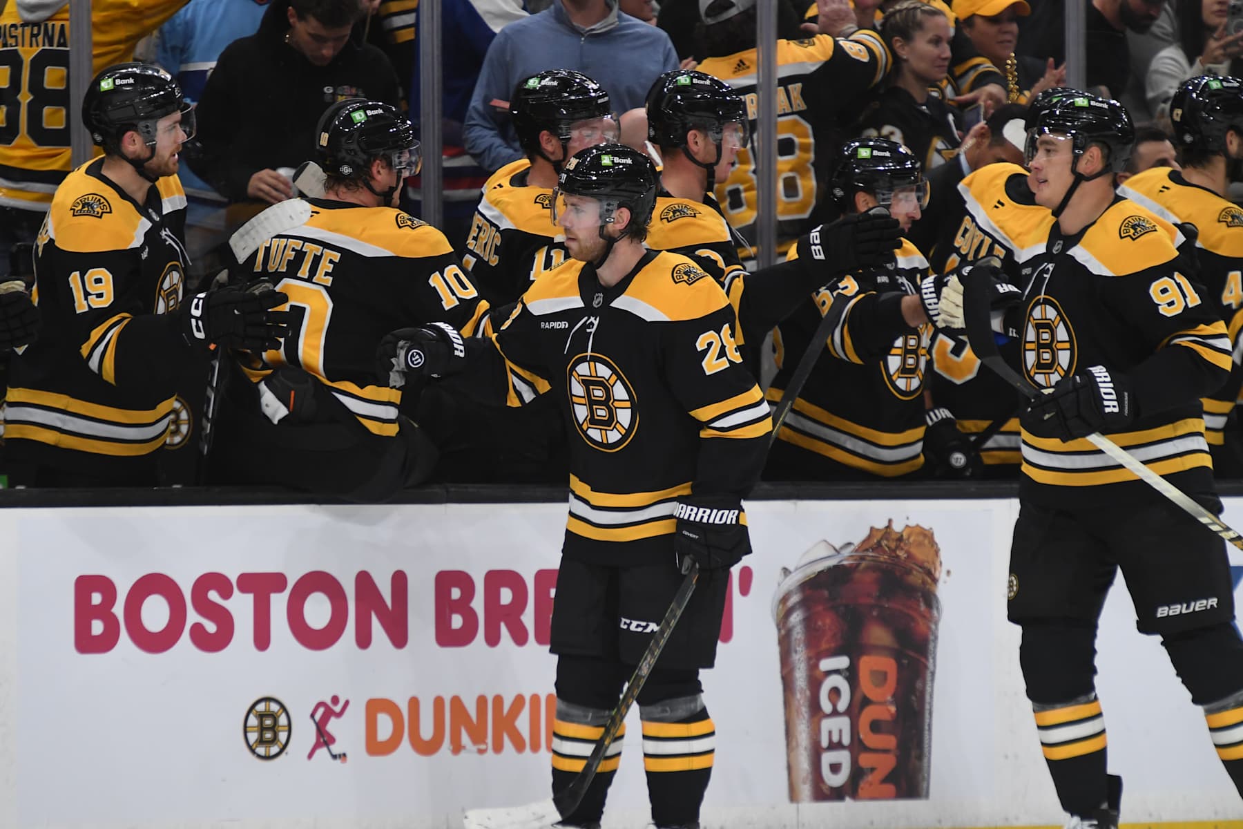 BOSTON, MASSACHUSETTS - OCTOBER 10: Elias Lindholm #28 and Nikita Zadorov #91 of the Boston Bruins celebrate the first-period goal against the Montreal Canadiens on October 10, 2024, at the TD Garden in Boston, Massachusetts. (Photo by Steve Babineau/NHLI via Getty Images)