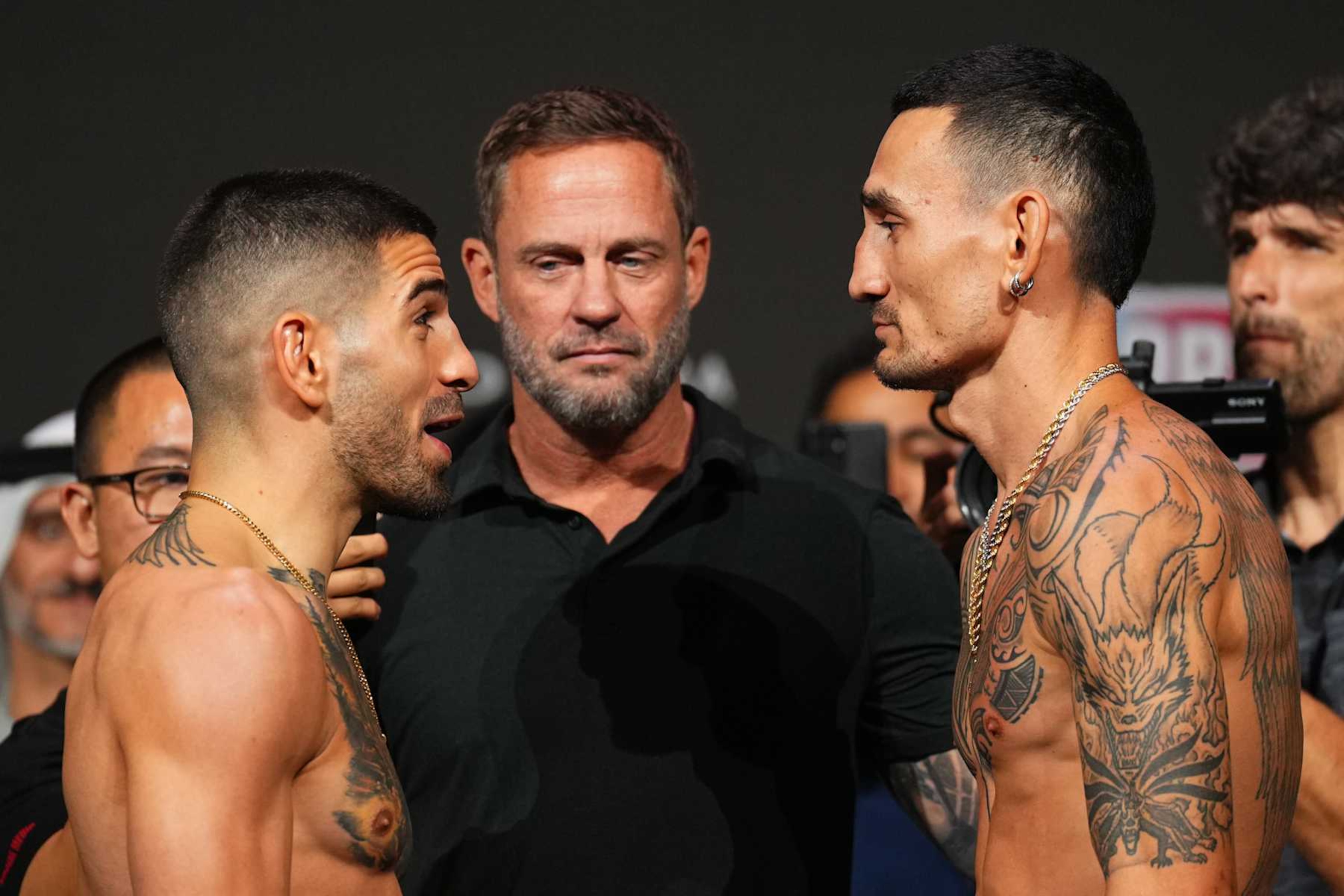 ABU DHABI, UNITED ARAB EMIRATES - OCTOBER 25: (L-R) Opponents Ilia Topuria of Spain and Max Holloway face off during the UFC 308 ceremonial weigh-in at Etihad Arena on October 25, 2024 in Abu Dhabi, United Arab Emirates. (Photo by Chris Unger/Zuffa LLC) ABU DHABI, UNITED ARAB EMIRATES - OCTOBER 25: (L-R) Opponents Ilia Topuria of Spain and Max Holloway face off during the UFC 308 ceremonial weigh-in at Etihad Arena on October 25, 2024 in Abu Dhabi, United Arab Emirates. (Photo by Chris Unger/Zuffa LLC)