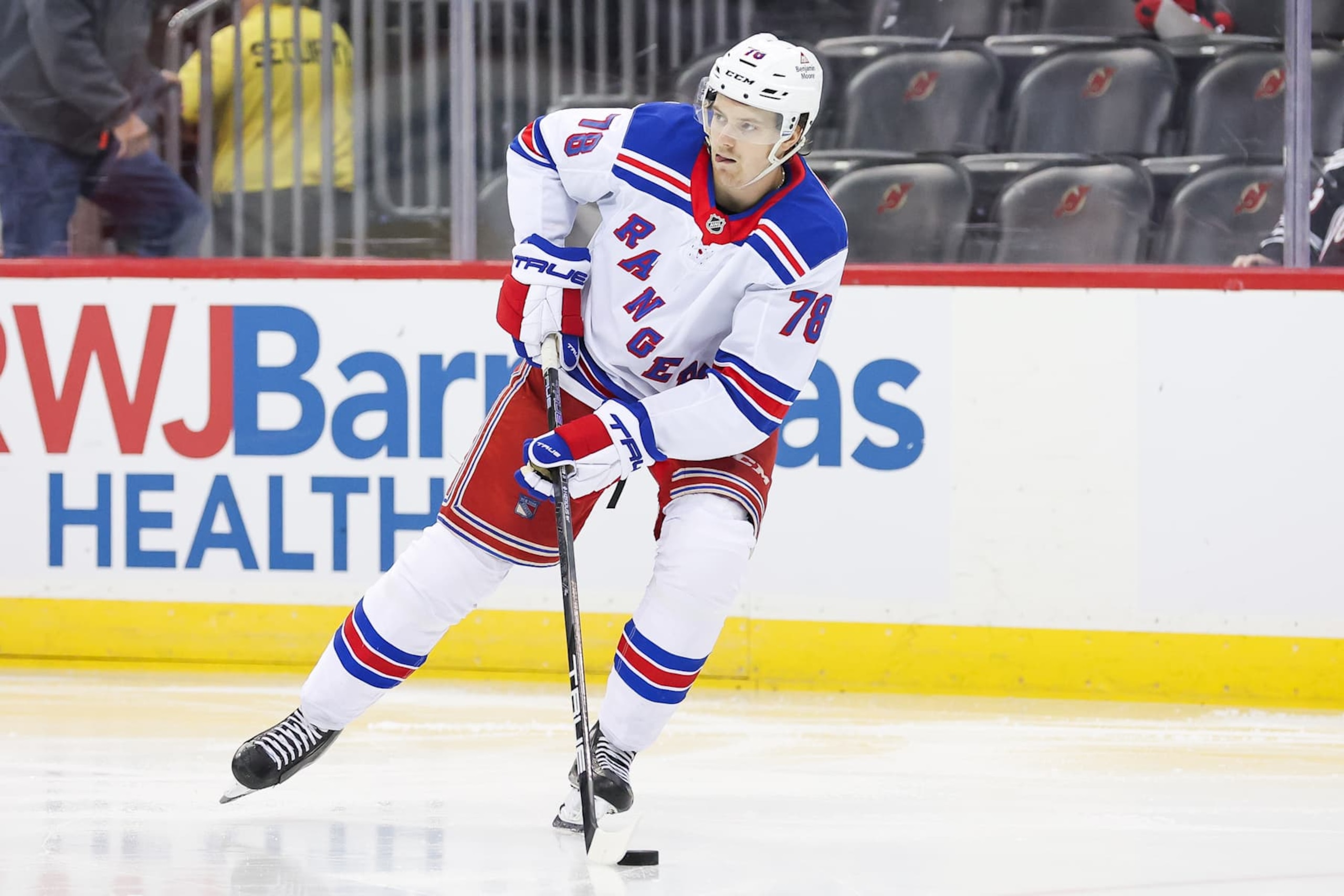 NEWARK, NEW JERSEY - SEPTEMBER 30: Brennan Othmann #78 of the New York Rangers skates with the puck during the second period in a preseason game against the New Jersey Devils at Prudential Center on September 30, 2024 in Newark, New Jersey. (Photo by Andrew Mordzynski/Getty Images)