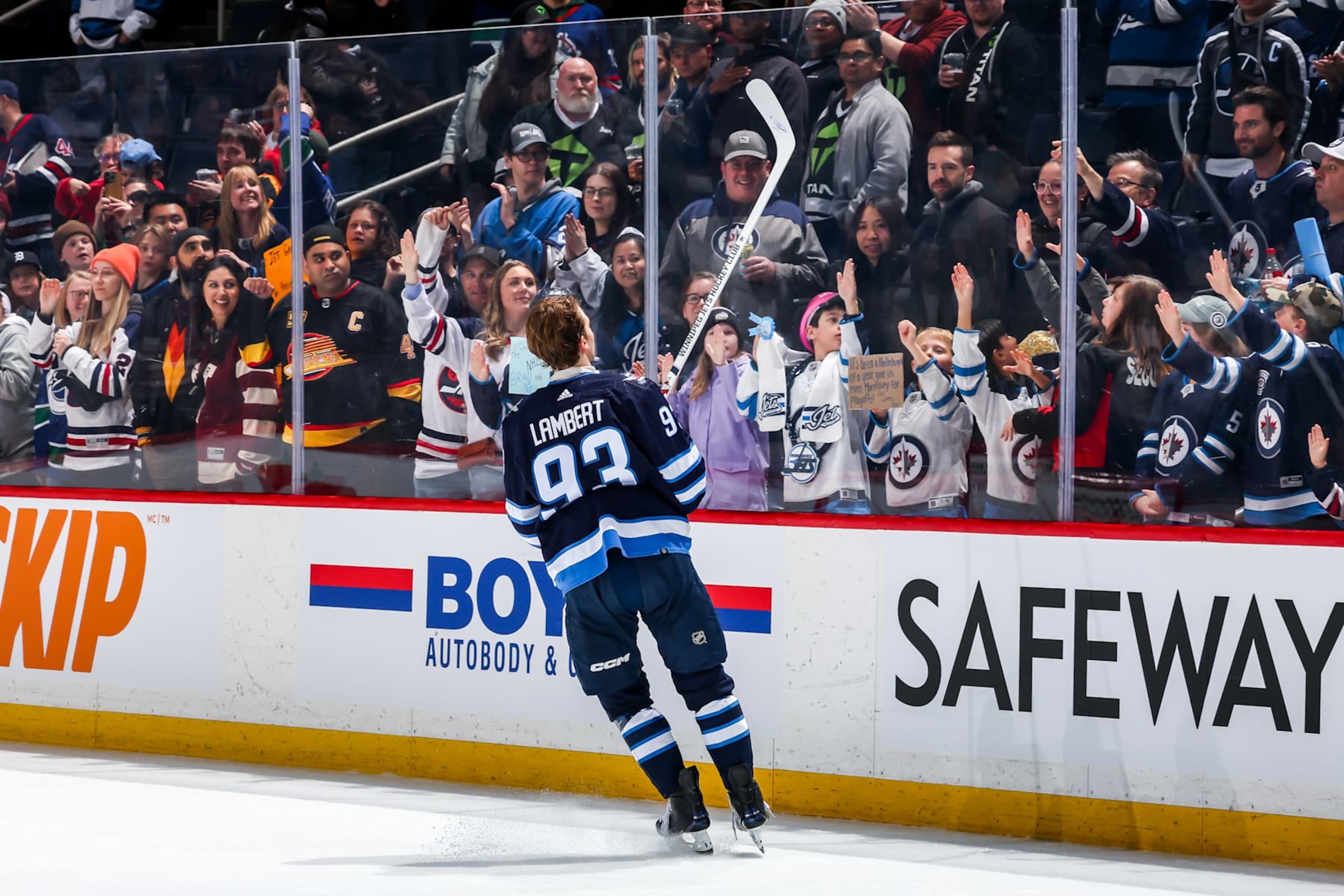 WINNIPEG, CANADA - APRIL 18: Brad Lambert #93 of the Winnipeg Jets sends a souvenir stick to fans after receiving second star honours following a 4-2 victory over the Vancouver Canucks at the Canada Life Centre on April 18, 2024 in Winnipeg, Manitoba, Canada. Lambert recorded his first career NHL point in the game. (Photo by Jonathan Kozub/NHLI via Getty Images)