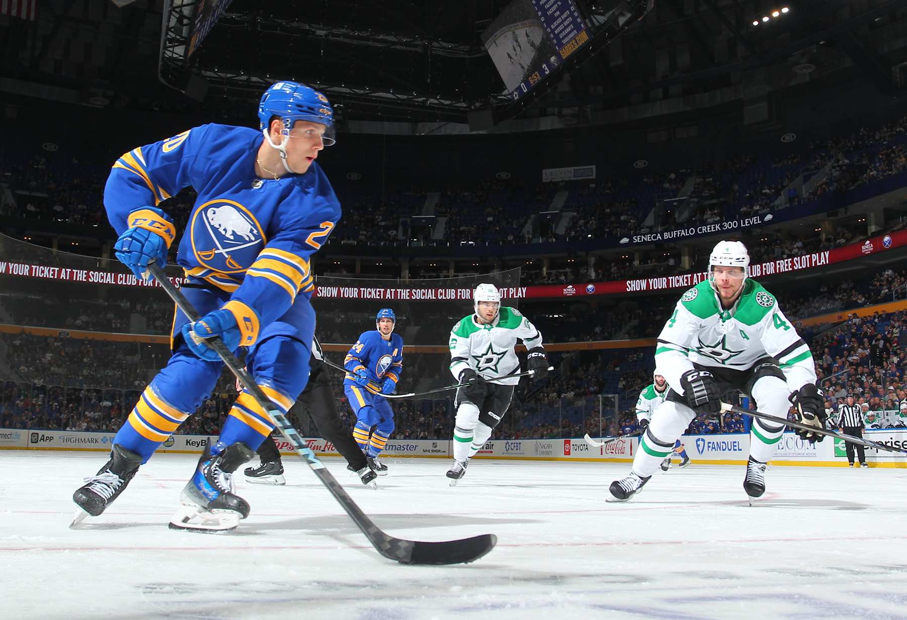 BUFFALO, NEW YORK - OCTOBER 22: Jiri Kulich #20 of the Buffalo Sabres skates with the puck against Miro Heiskanen #4 of the Dallas Stars during an NHL game on October 22, 2024 at KeyBank Center in Buffalo, New York. Buffalo won, 4-2. (Photo by Bill Wippert/NHLI via Getty Images)