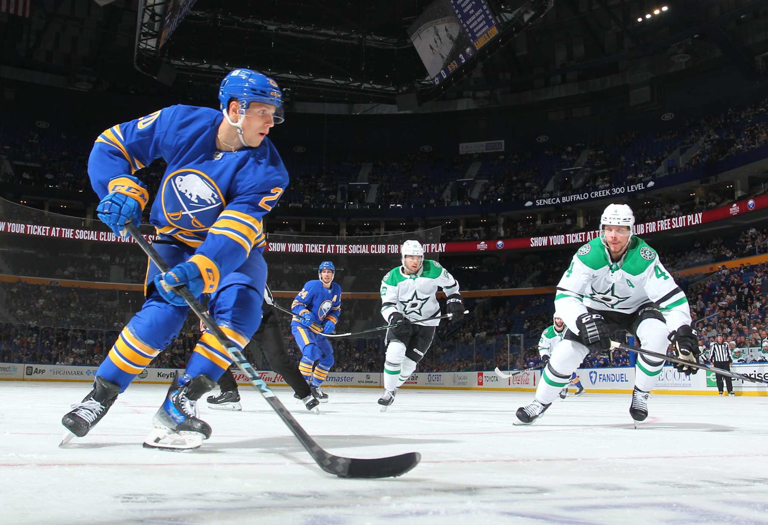BUFFALO, NEW YORK - OCTOBER 22: Jiri Kulich #20 of the Buffalo Sabres skates with the puck against Miro Heiskanen #4 of the Dallas Stars during an NHL game on October 22, 2024 at KeyBank Center in Buffalo, New York. Buffalo won, 4-2. (Photo by Bill Wippert/NHLI via Getty Images)