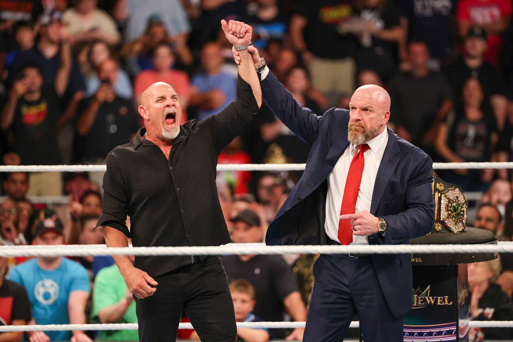 ATLANTA, GEORGIA - OCTOBER 5: Bill Goldberg poses in the ring with Triple H during Bad Blood at State Farm Arena on October 5, 2024 in Atlanta, Georgia.  (Photo by WWE/Getty Images)
