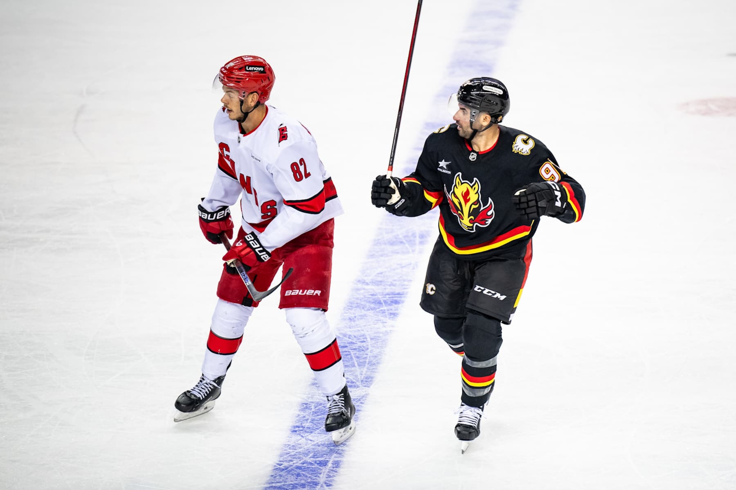 CALGARY, AB - OCTOBER 24: Carolina Hurricanes Center Jesperi Kotkaniemi (82) and Calgary Flames Center Nazem Kadri (91) in action during the second period of an NHL game on October 24, 2024, at the Scotiabank Saddledome in Calgary, AB. (Photo by Brett Holmes/Icon Sportswire via Getty Images) CALGARY, AB - OCTOBER 24: Carolina Hurricanes Center Jesperi Kotkaniemi (82) and Calgary Flames Center Nazem Kadri (91) in action during the second period of an NHL game on October 24, 2024, at the Scotiabank Saddledome in Calgary, AB. (Photo by Brett Holmes/Icon Sportswire via Getty Images)