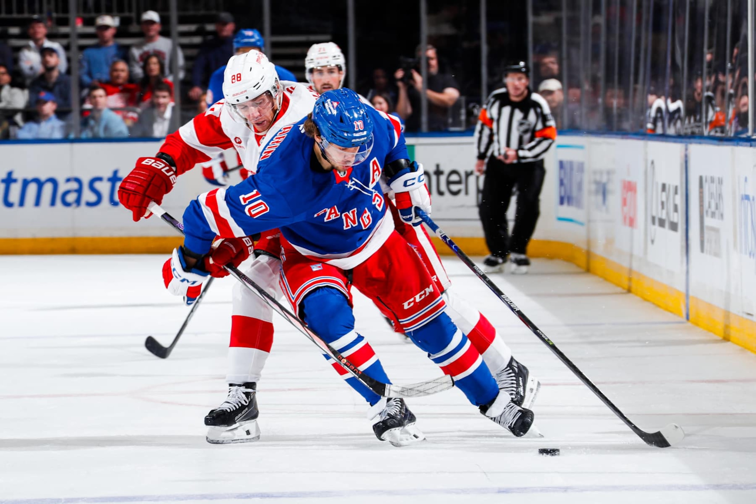 NEW YORK, NEW YORK - OCTOBER 14: Artemi Panarin #10 of the New York Rangers skates with the puck against Patrick Kane #88 of the Detroit Red Wings at Madison Square Garden on October 14, 2024 in New York City. (Photo by Jared Silber/NHLI via Getty Images) NEW YORK, NEW YORK - OCTOBER 14: Artemi Panarin #10 of the New York Rangers skates with the puck against Patrick Kane #88 of the Detroit Red Wings at Madison Square Garden on October 14, 2024 in New York City. (Photo by Jared Silber/NHLI via Getty Images)
