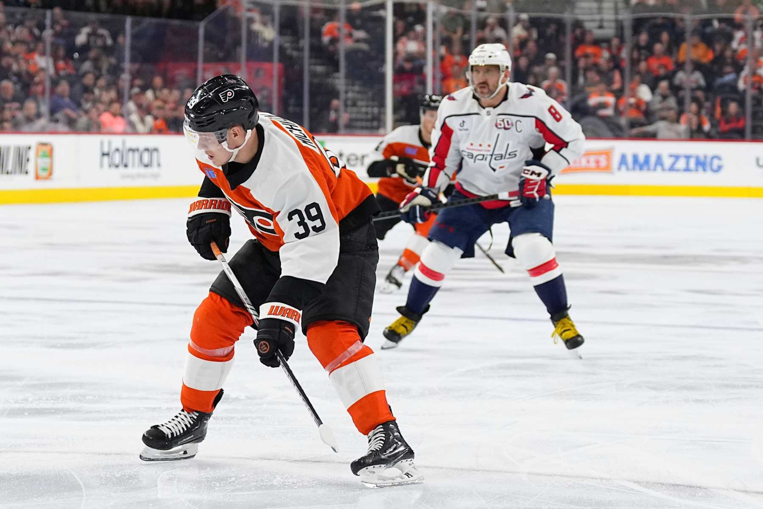 PHILADELPHIA, PENNSYLVANIA - OCTOBER 22: Matvei Michkov #39 of the Philadelphia Flyers skates against Alex Ovechkin #8 of the Washington Capitals at the Wells Fargo Center on October 22, 2024 in Philadelphia, Pennsylvania. The Washington Capitals defeated the Philadelphia Flyers 4-1. (Photo by Mitchell Leff/Getty Images) PHILADELPHIA, PENNSYLVANIA - OCTOBER 22: Matvei Michkov #39 of the Philadelphia Flyers skates against Alex Ovechkin #8 of the Washington Capitals at the Wells Fargo Center on October 22, 2024 in Philadelphia, Pennsylvania. The Washington Capitals defeated the Philadelphia Flyers 4-1. (Photo by Mitchell Leff/Getty Images)