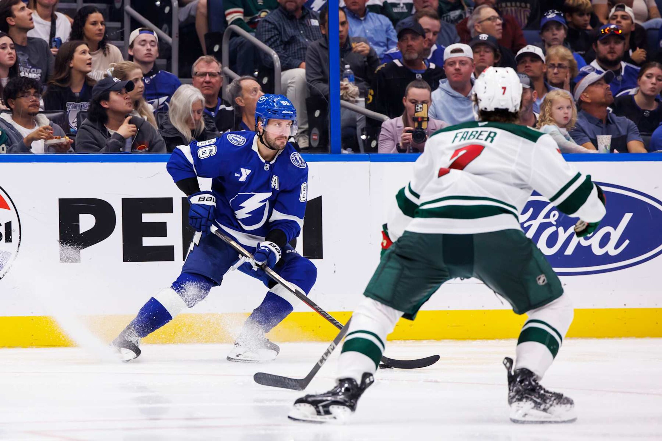TAMPA, FL - OCTOBER 24: Nikita Kucherov #86 of the Tampa Bay Lightning skates against Brock Faber #7 of the Minnesota Wild during the third period at Amalie Arena on October 24, 2024 in Tampa, Florida. (Photo by Mark LoMoglio/NHLI via Getty Images) TAMPA, FL - OCTOBER 24: Nikita Kucherov #86 of the Tampa Bay Lightning skates against Brock Faber #7 of the Minnesota Wild during the third period at Amalie Arena on October 24, 2024 in Tampa, Florida. (Photo by Mark LoMoglio/NHLI via Getty Images)