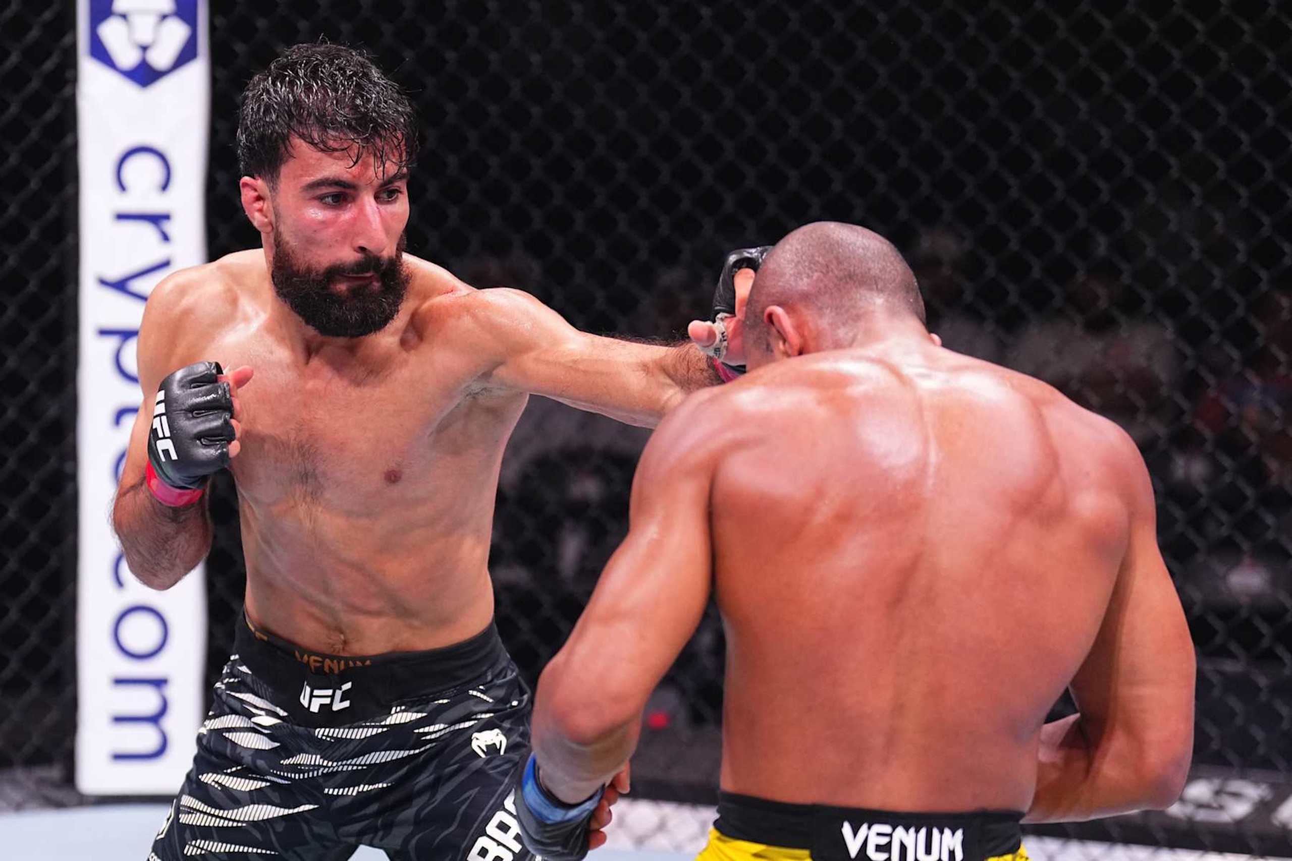 ABU DHABI, UNITED ARAB EMIRATES - OCTOBER 26: (L-R) Farid Basharat of Afghanistan punches Victor Hugo of Brazil in a bantamweight fight during the UFC 308 event at Etihad Arena on October 26, 2024 in Abu Dhabi, United Arab Emirates.  (Photo by Chris Unger/Zuffa LLC)