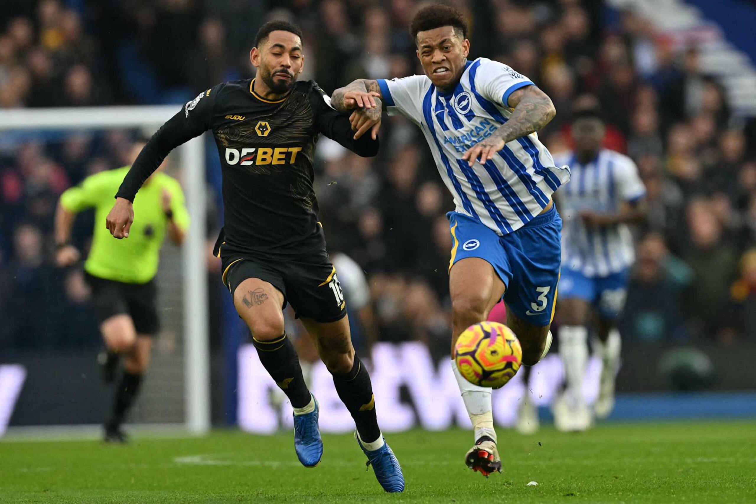 Wolverhampton Wanderers' Brazilian striker #10 Matheus Cunha (L) vies with Brighton's Brazilian defender #03 Igor Julio (R) during the English Premier League football match between Brighton and Hove Albion and Wolverhampton Wanderers at the American Express Community Stadium in Brighton, southern England, on October 26, 2024. (Photo by Glyn KIRK / AFP) / RESTRICTED TO EDITORIAL USE. No use with unauthorized audio, video, data, fixture lists, club/league logos or 'live' services. Online in-match use limited to 120 images. An additional 40 images may be used in extra time. No video emulation. Social media in-match use limited to 120 images. An additional 40 images may be used in extra time. No use in betting publications, games or single club/league/player publications. /  (Photo by GLYN KIRK/AFP via Getty Images)