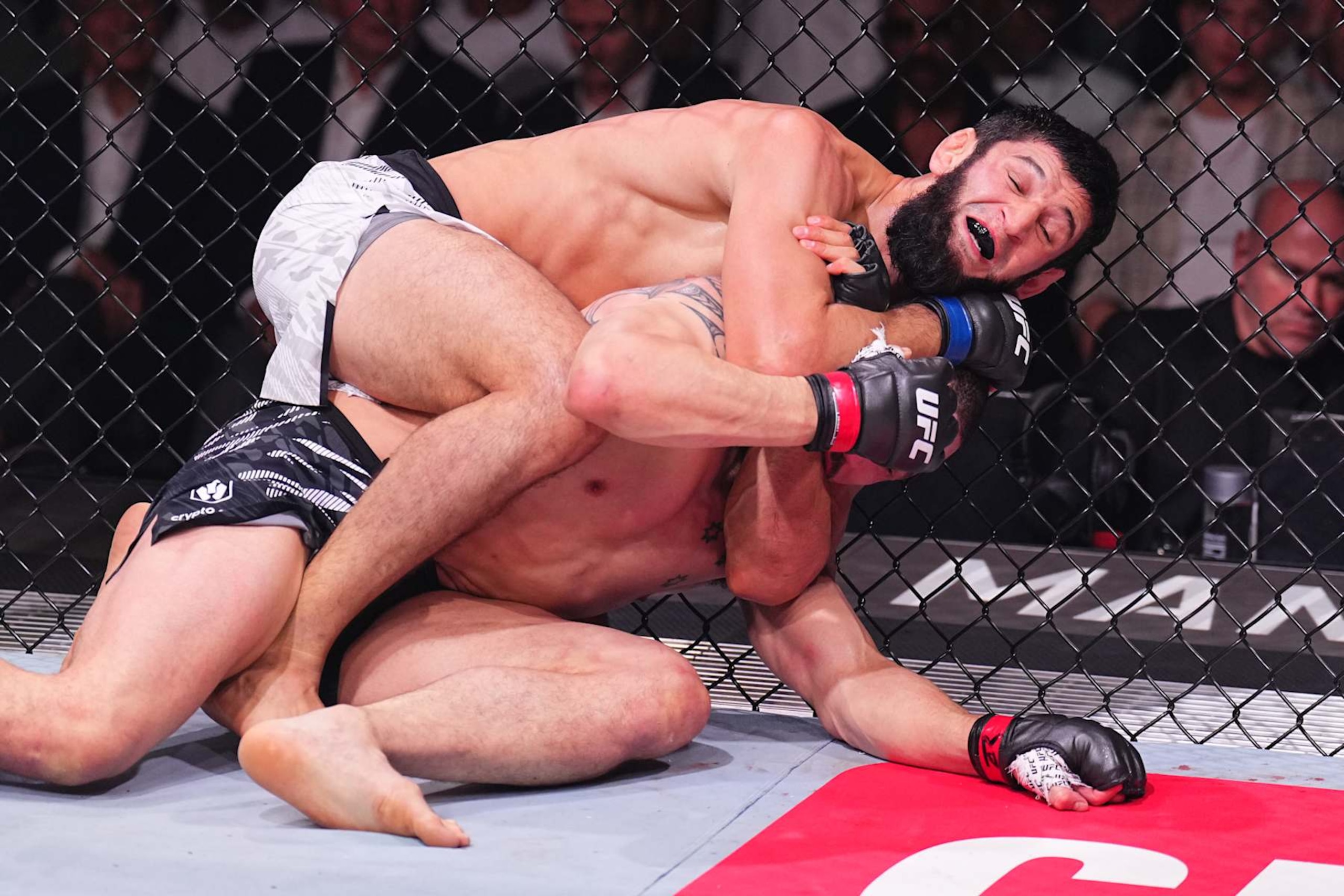 ABU DHABI, UNITED ARAB EMIRATES - OCTOBER 26: (L-R) Khamzat Chimaev of Russia secures a submission against \rw in a middleweight fight during the UFC 308 event at Etihad Arena on October 26, 2024 in Abu Dhabi, United Arab Emirates.  (Photo by Chris Unger/Zuffa LLC)