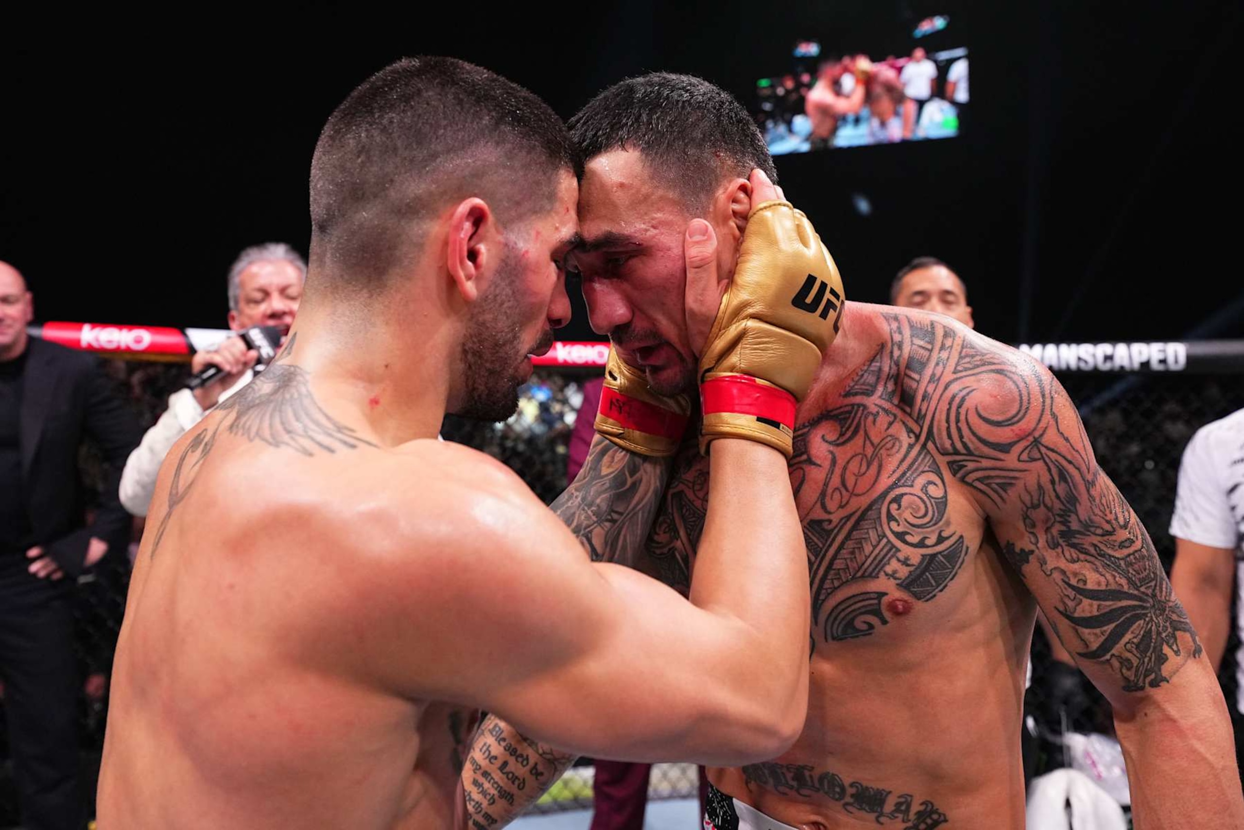 ABU DHABI, UNITED ARAB EMIRATES - OCTOBER 26: (L-R) Ilia Topuria of Spain and Max Holloway talk after their UFC featherweight championship fight during the UFC 308 event at Etihad Arena on October 26, 2024 in Abu Dhabi, United Arab Emirates.  (Photo by Chris Unger/Zuffa LLC)