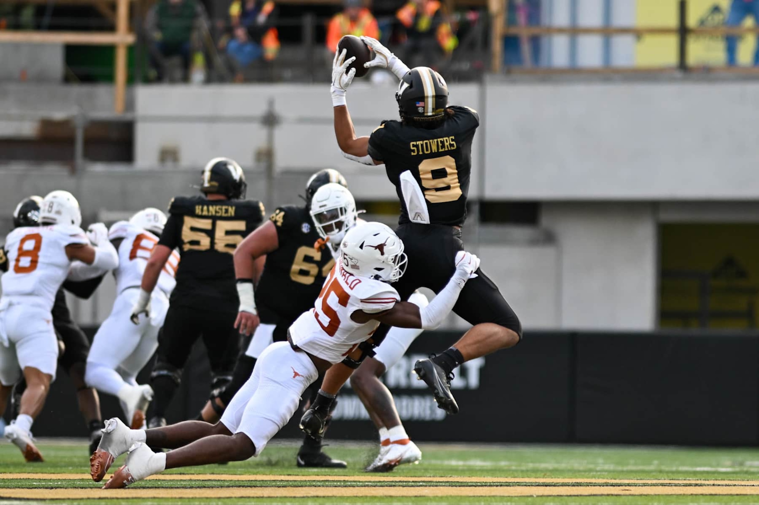 NASHVILLE, TENNESSEE - OCTOBER 26: Eli Stowers #9 of the Vanderbilt Commodores catches a pass against Jelani McDonald #25 of the Texas Longhorns in the first half at FirstBank Stadium on October 26, 2024 in Nashville, Tennessee. (Photo by Carly Mackler/Getty Images)