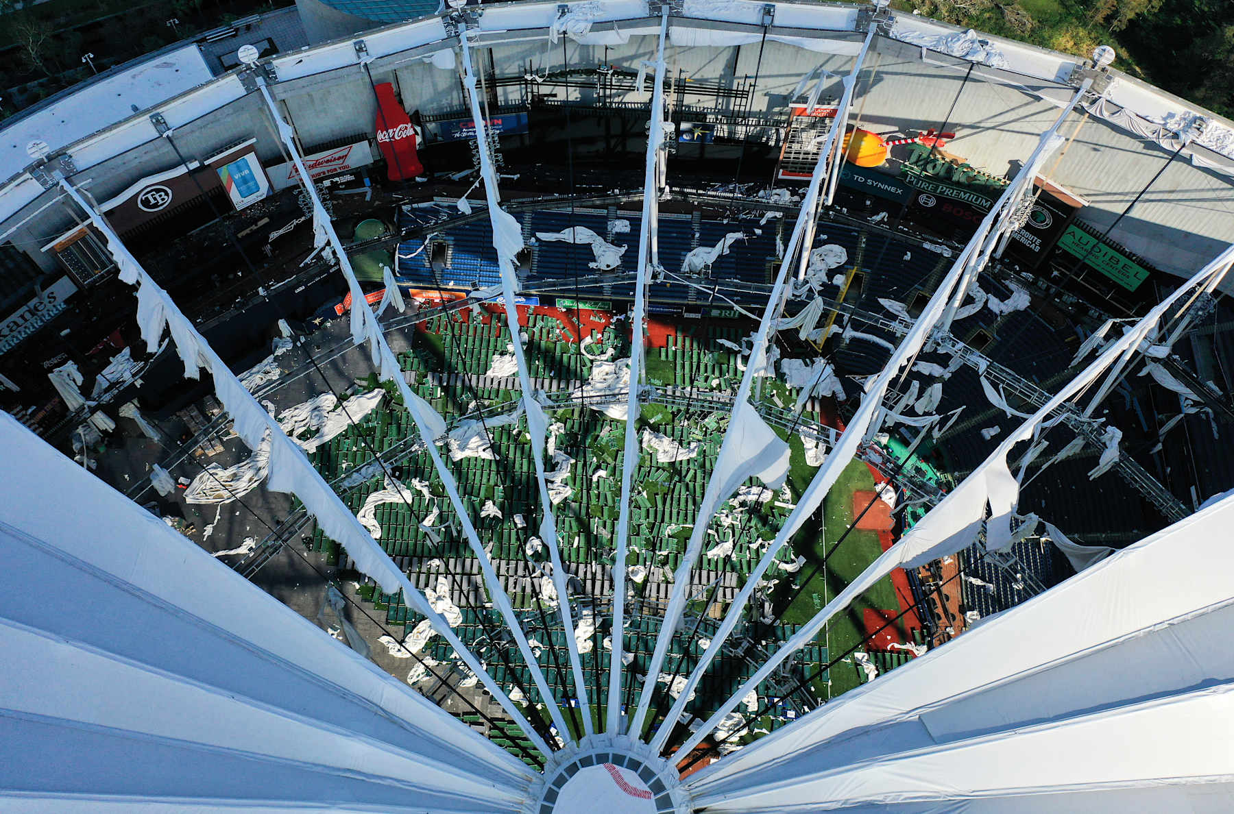 CHIMCHIME, ST  PETERSBURG, FLORIDA, UNITED STATES - 2024/10/13: (EDITORS NOTE: Image taken with drone) In this aerial view, the domed roof at Tropicana Field, the home of the Tampa Bay Rays, is seen ripped to shreds from Hurricane Miltonís powerful winds in St. Petersburg. The storm passed through the area on October 10, 2024, making landfall as a Category 3 hurricane in Siesta Key, Florida. (Photo by Paul Hennessy/SOPA Images/LightRocket via Getty Images)