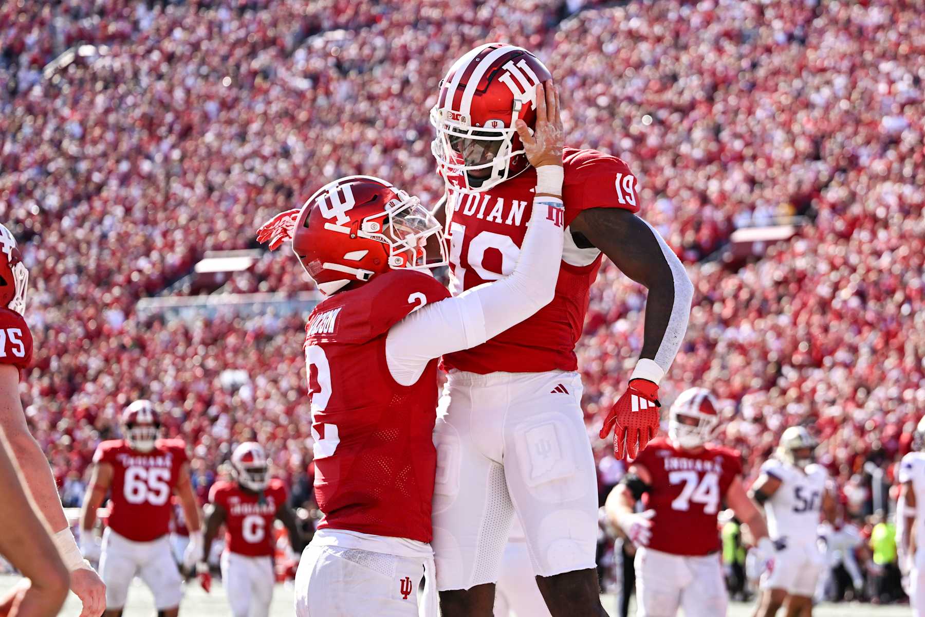 BLOOMINGTON, IN - OCTOBER 26: Indiana Hoosiers QB Tayven Jackson (2) and WR Miles Cross (19) celebrate a touchdown during a college football game between the Washington Huskies and Indiana Hoosiers on October 26, 2024 at Memorial Stadium in Bloomington, IN (Photo by James Black/Icon Sportswire via Getty Images)