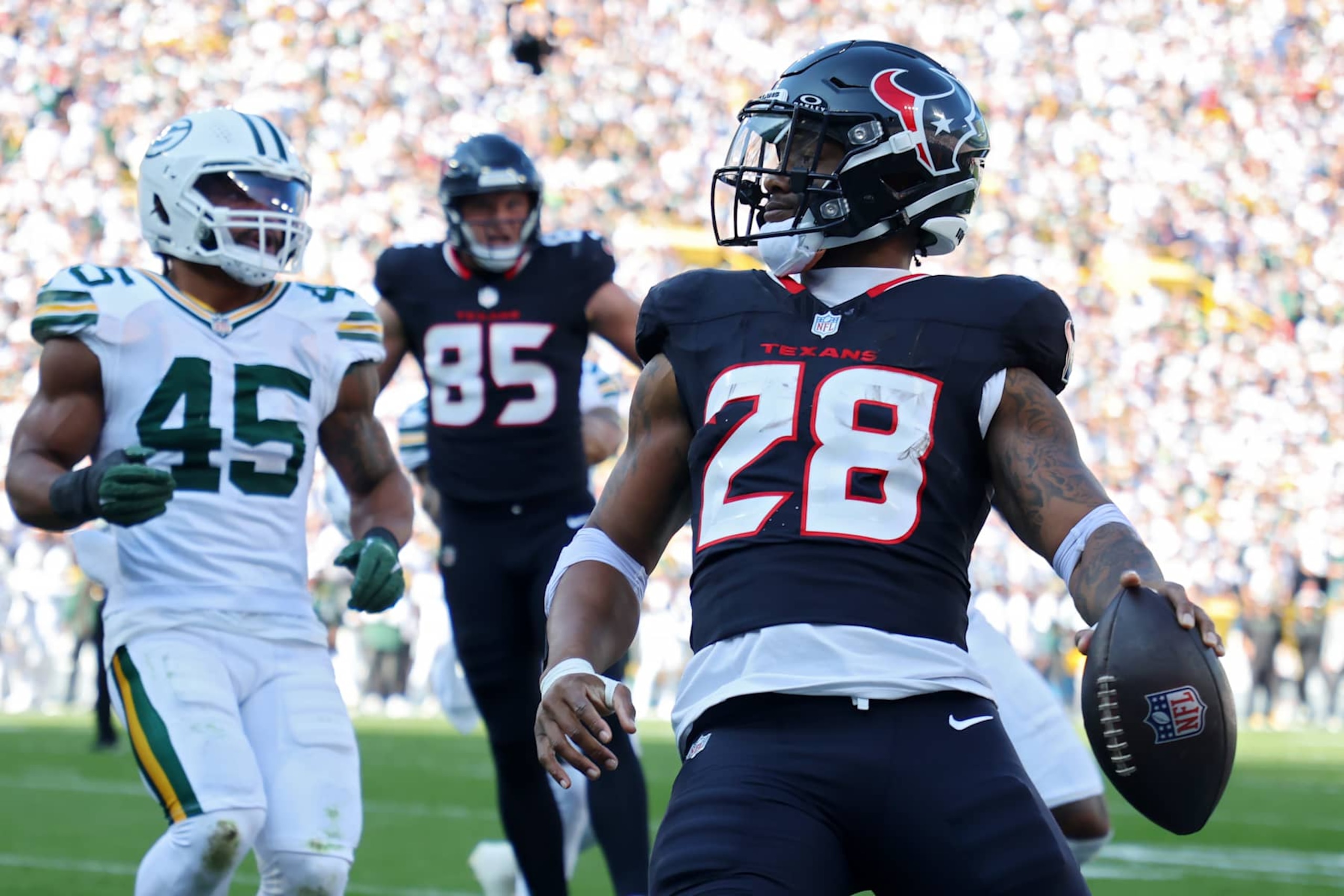 GREEN BAY, WISCONSIN - OCTOBER 20: Joe Mixon #28 of the Houston Texans scores a touchdown during the second quarter against the Green Bay Packers at Lambeau Field on October 20, 2024 in Green Bay, Wisconsin. (Photo by Stacy Revere/Getty Images) GREEN BAY, WISCONSIN - OCTOBER 20: Joe Mixon #28 of the Houston Texans scores a touchdown during the second quarter against the Green Bay Packers at Lambeau Field on October 20, 2024 in Green Bay, Wisconsin. (Photo by Stacy Revere/Getty Images)