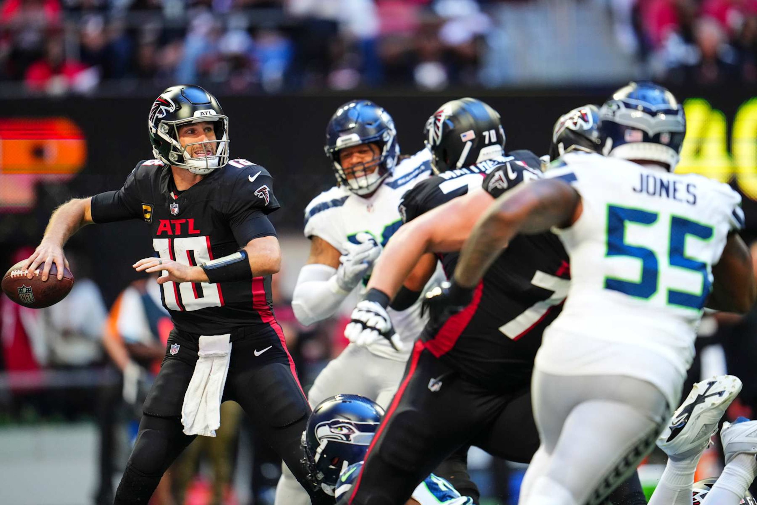 ATLANTA, GA - OCTOBER 20: Kirk Cousins #18 of the Atlanta Falcons throws the ball during an NFL football game against the Seattle Seahawks at Mercedes-Benz Stadium on October 20, 2024 in Atlanta, Georgia. (Photo by Cooper Neill/Getty Images) ATLANTA, GA - OCTOBER 20: Kirk Cousins #18 of the Atlanta Falcons throws the ball during an NFL football game against the Seattle Seahawks at Mercedes-Benz Stadium on October 20, 2024 in Atlanta, Georgia. (Photo by Cooper Neill/Getty Images)