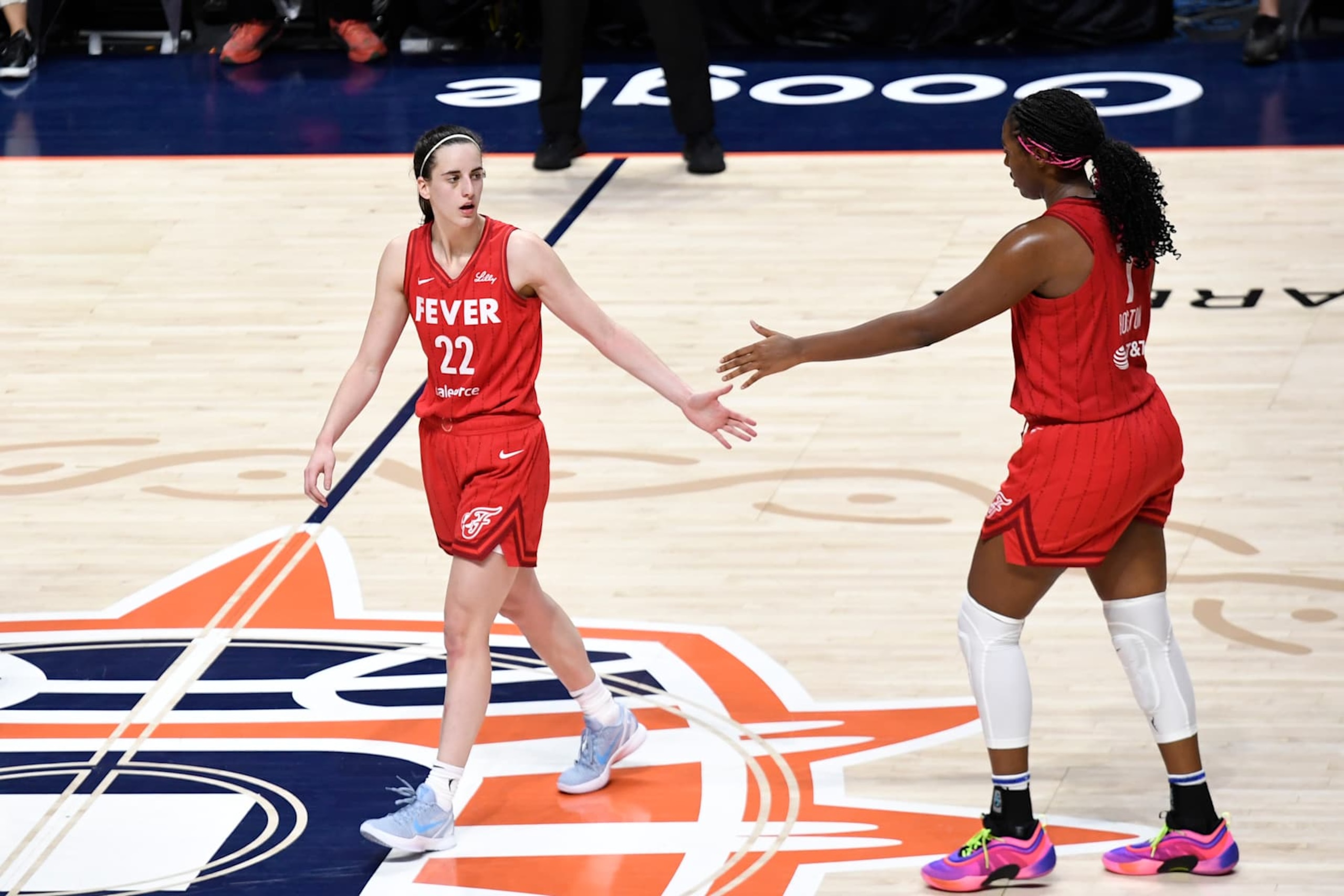 UNCASVILLE, CT - SEPTEMBER 25: Indiana Fever guard Caitlin Clark (22) and Indiana Fever forward Aliyah Boston (7) high five during game 2 of the first round of the WNBA Playoffs between the Indiana Fever and the Connecticut Sun on September 25, 2024, at Mohegan Sun Arena in Uncasville, CT. (Photo by Joseph Denhoff/Icon Sportswire via Getty Images) UNCASVILLE, CT - SEPTEMBER 25: Indiana Fever guard Caitlin Clark (22) and Indiana Fever forward Aliyah Boston (7) high five during game 2 of the first round of the WNBA Playoffs between the Indiana Fever and the Connecticut Sun on September 25, 2024, at Mohegan Sun Arena in Uncasville, CT. (Photo by Joseph Denhoff/Icon Sportswire via Getty Images)