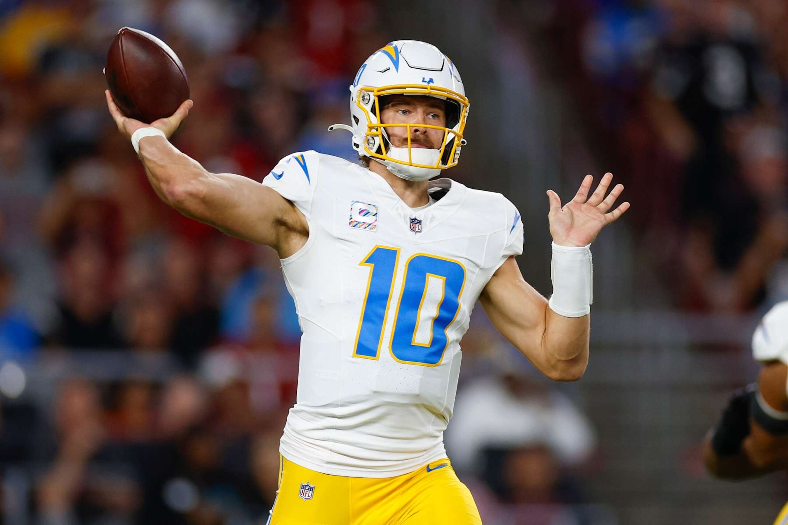 GLENDALE, ARIZONA - OCTOBER 21: Justin Herbert #10 of the Los Angeles Chargers throws a pass during the first quarter against the Arizona Cardinals at State Farm Stadium on October 21, 2024 in Glendale, Arizona. (Photo by Brandon Sloter/Getty Images)