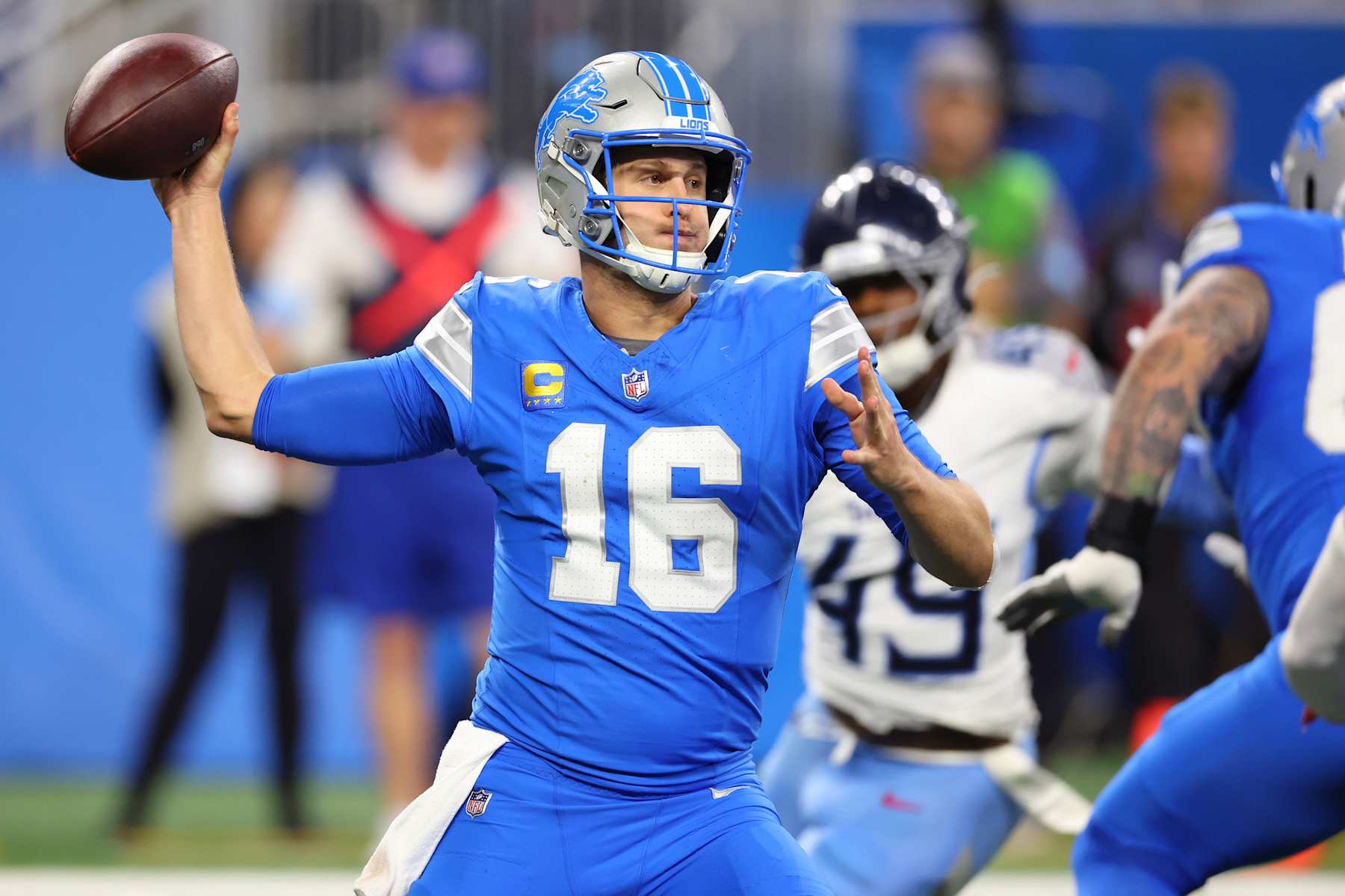 DETROIT, MICHIGAN - OCTOBER 27: Jared Goff #16 of the Detroit Lions looks to pass in the third quarter of a game against the Tennessee Titans at Ford Field on October 27, 2024 in Detroit, Michigan. (Photo by Gregory Shamus/Getty Images)
