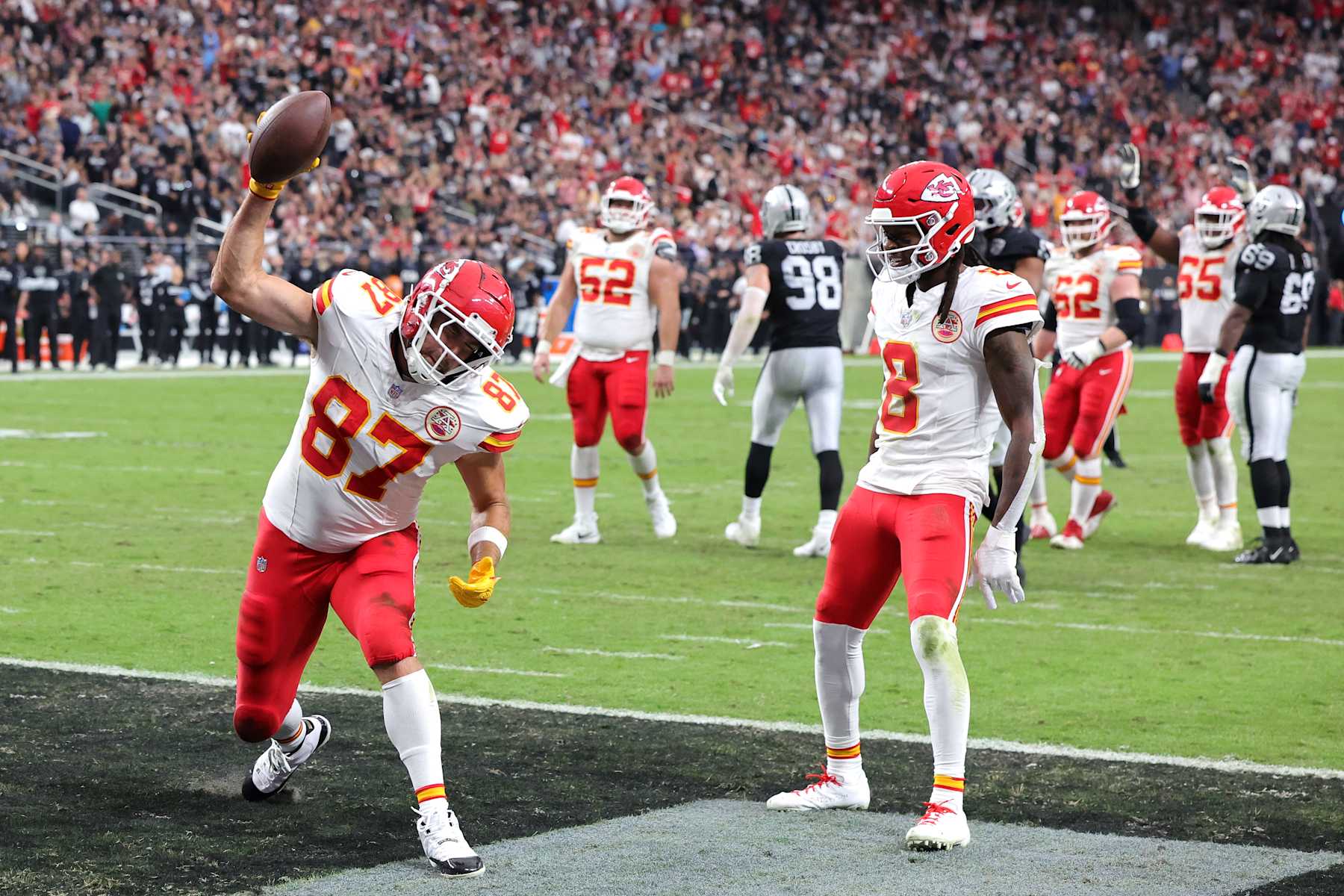 LAS VEGAS, NEVADA - OCTOBER 27: DeAndre Hopkins #8 watches as Travis Kelce #87 of the Kansas City Chiefs celebrates after his receiving touchdown in the second quarter of a game against the Las Vegas Raiders at Allegiant Stadium on October 27, 2024 in Las Vegas, Nevada. (Photo by Ethan Miller/Getty Images)