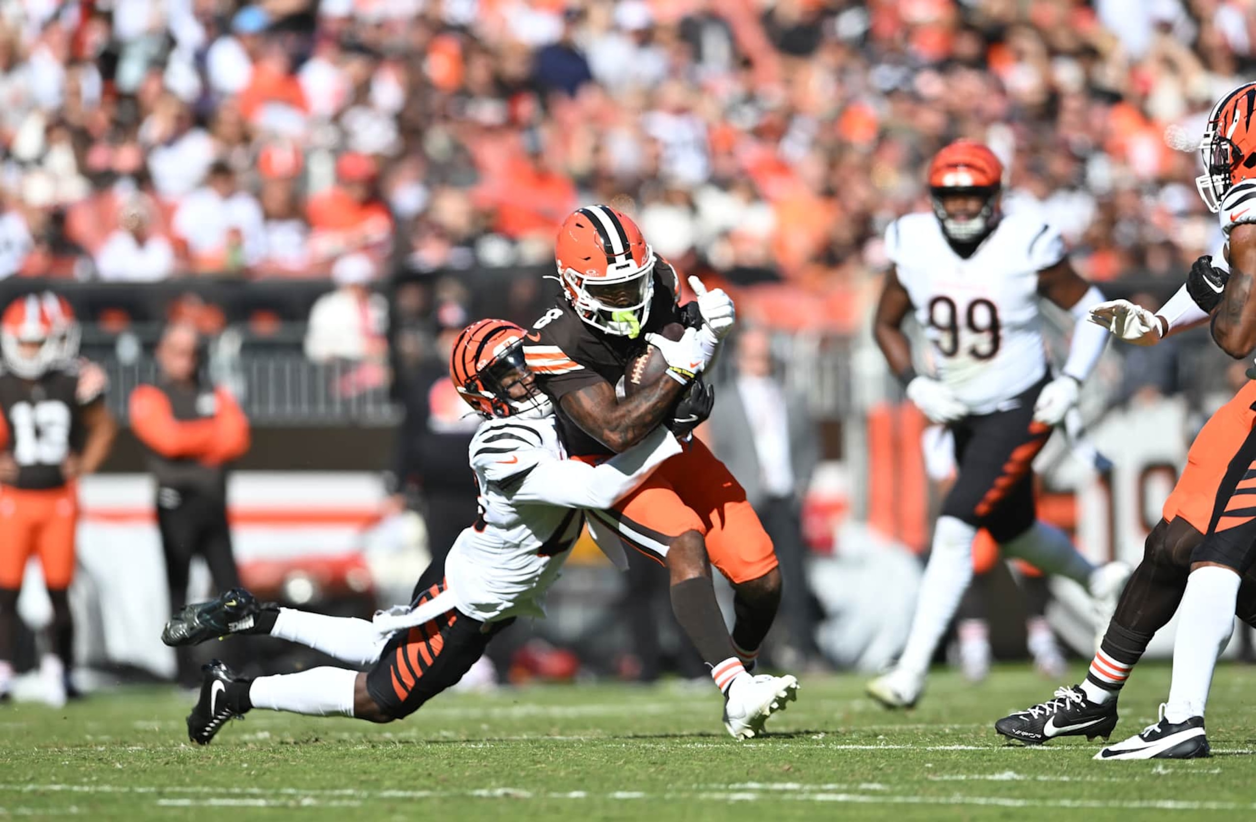 CLEVELAND, OHIO - OCTOBER 20: Elijah Moore #8 of the Cleveland Browns catches a pass against Josh Newton #28 of the Cincinnati Bengals in the third quarter of a game at Huntington Bank Field on October 20, 2024 in Cleveland, Ohio. (Photo by Nick Cammett/Getty Images)