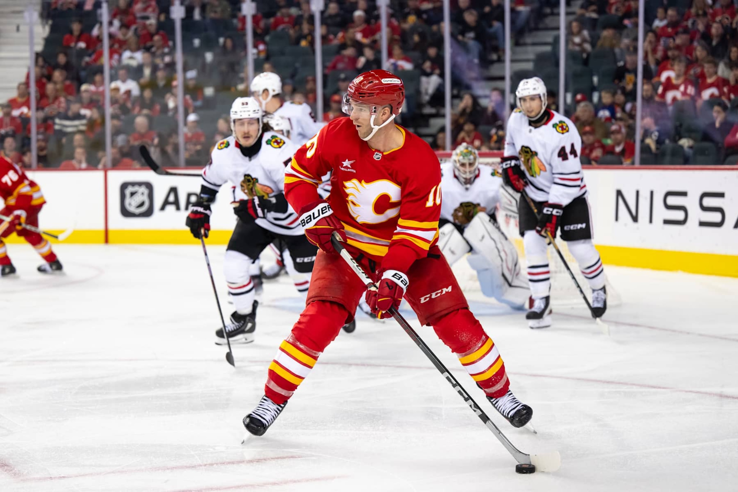 CALGARY, AB - OCTOBER 15: Calgary Flames Left Wing Jonathan Huberdeau (10) skates with the puck during the third period of an NHL game between the Calgary Flames and the Chicago Blackhawks on October 15, 2024, at the Scotiabank Saddledome in Calgary, AB. (Photo by Brett Holmes/Icon Sportswire via Getty Images)