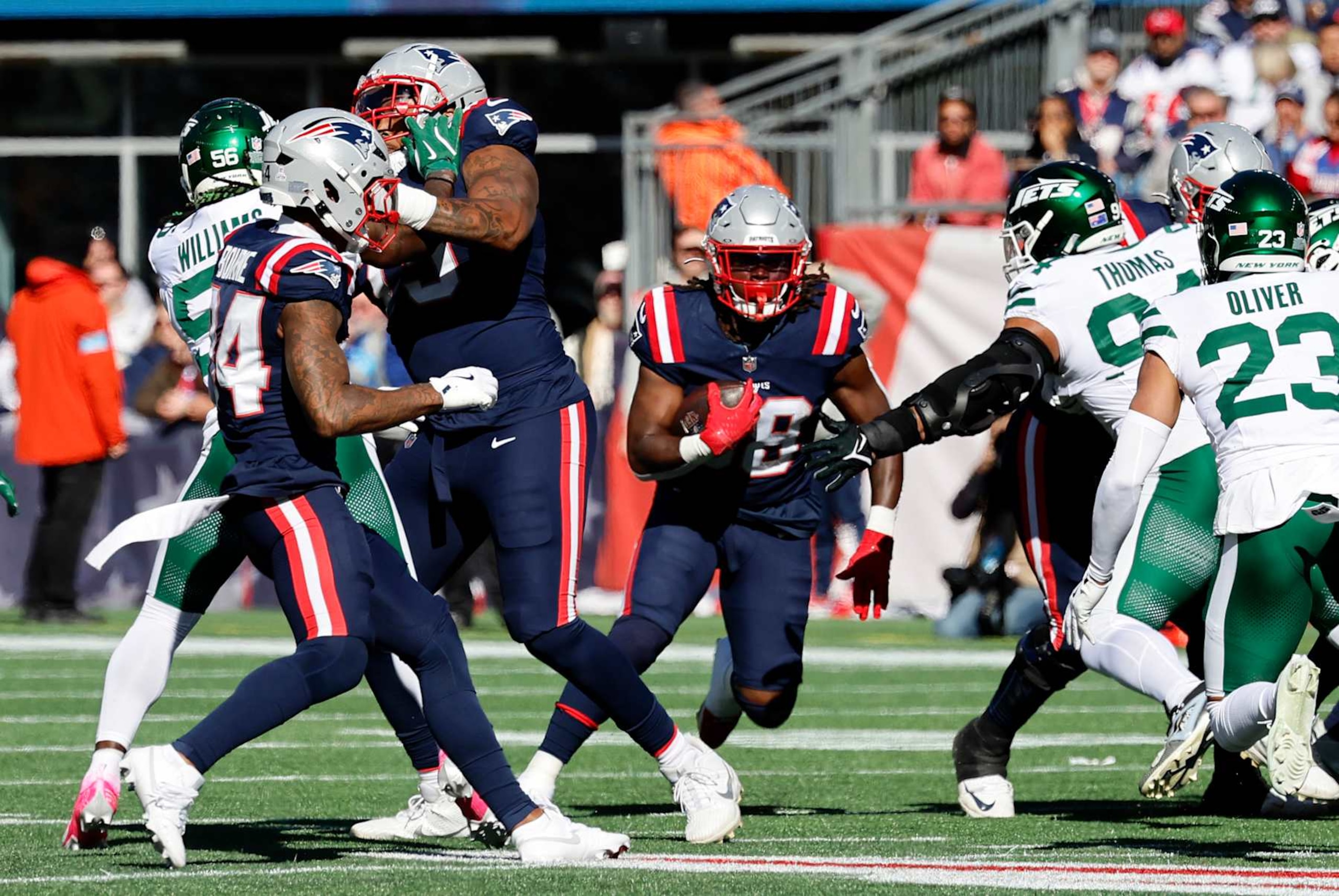 FOXBOROUGH, MA - OCTOBER 27: New England Patriots running back Rhamondre Stevenson (38) hits the hole in the line during a game between the New England Patriots and the New York Jets on October 27, 2024, at Gillette Stadium in Foxborough, Massachusetts. (Photo by Fred Kfoury III/Icon Sportswire via Getty Images)