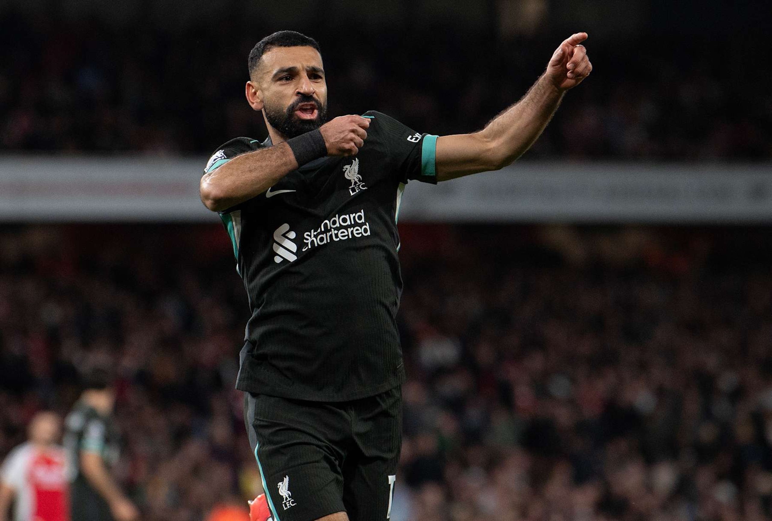 LONDON, ENGLAND - OCTOBER 27:  Mohamed Salah celebrates his late equaliser for Liverpool during the Premier League match between Arsenal FC and Liverpool FC at Emirates Stadium on October 27, 2024 in London, England. (Photo by Visionhaus/Getty Images)