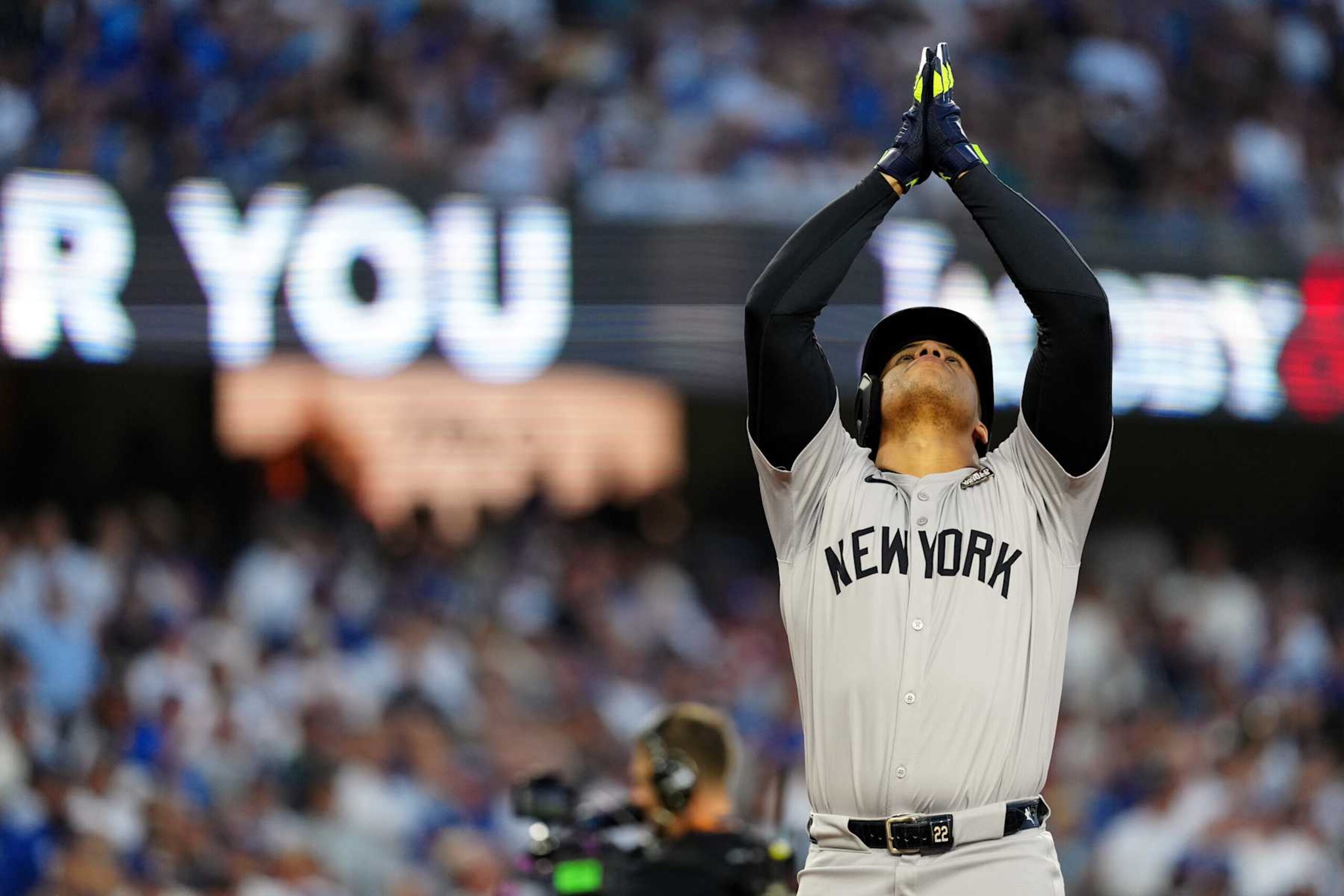 LOS ANGELES, CA - OCTOBER 26:  Juan Soto #22 of the New York Yankees touches home plate and points to the sky after hitting a solo home run in the third inning during Game 2 of the 2024 World Series presented by Capital One between the New York Yankees and the Los Angeles Dodgers at Dodger Stadium on Saturday, October 26, 2024 in Los Angeles, California. (Photo by Daniel Shirey/MLB Photos via Getty Images)