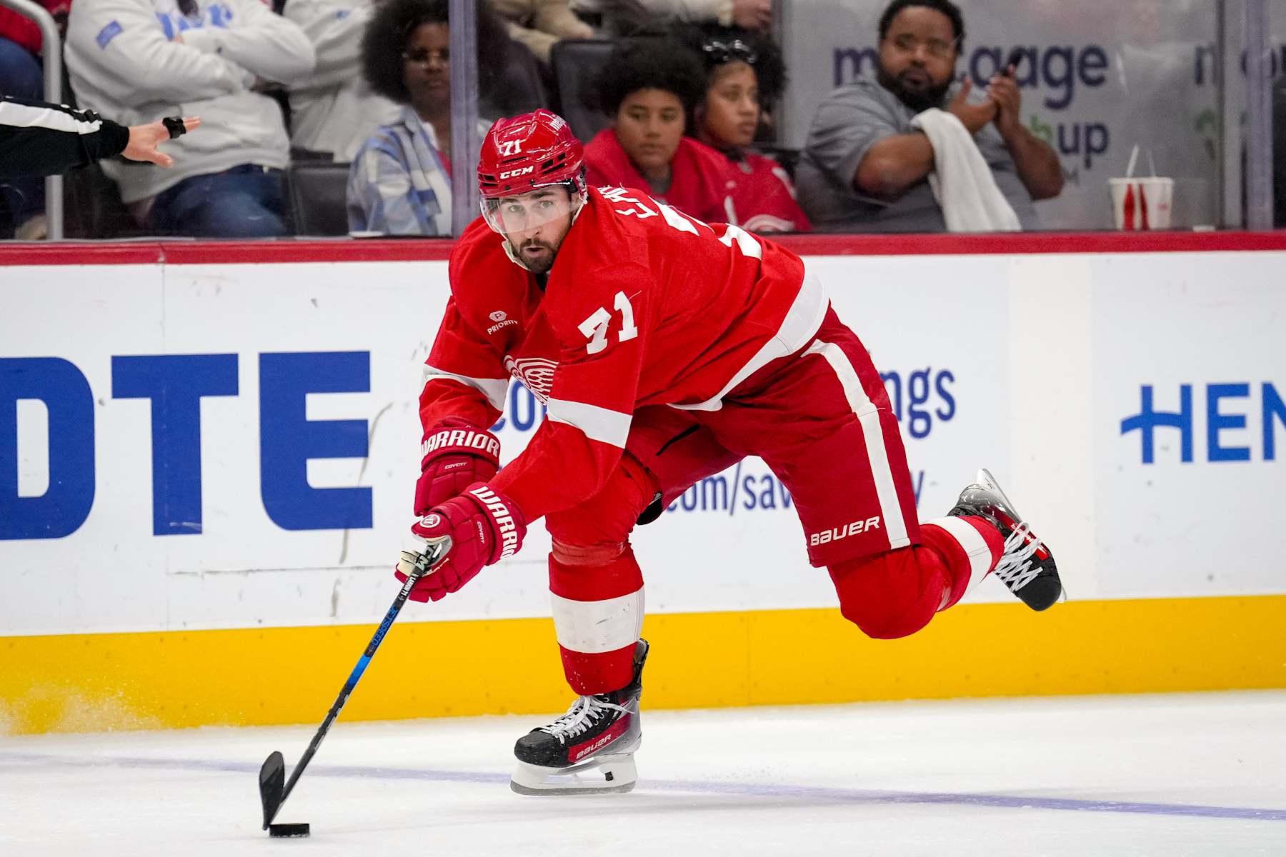 DETROIT, MICHIGAN - OCTOBER 24: Dylan Larkin #71 of the Detroit Red Wings skates with the puck against against the New Jersey Devils during the second period at Little Caesars Arena on October 24, 2024 in Detroit, Michigan. (Photo by Nic Antaya/Getty Images)