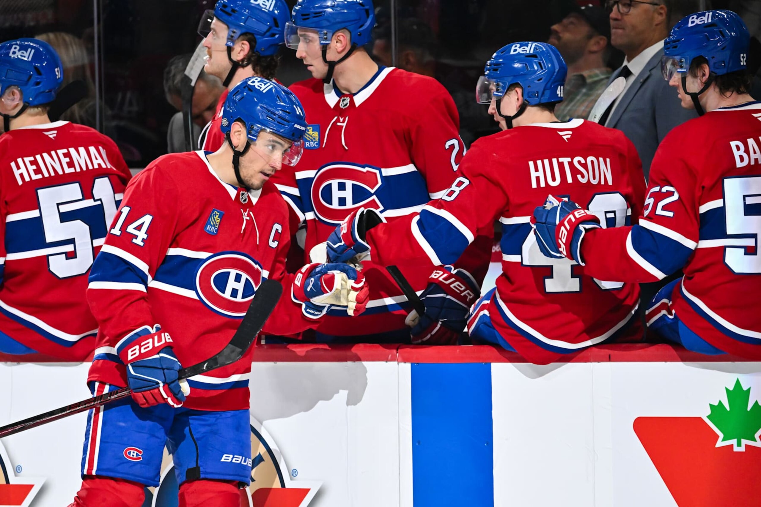 MONTREAL, CANADA - OCTOBER 22:  Nick Suzuki #14 of the Montreal Canadiens celebrates his goal with teammates on the bench during the first period against the New York Rangers at the Bell Centre on October 22, 2024 in Montreal, Quebec, Canada.  (Photo by Minas Panagiotakis/Getty Images)