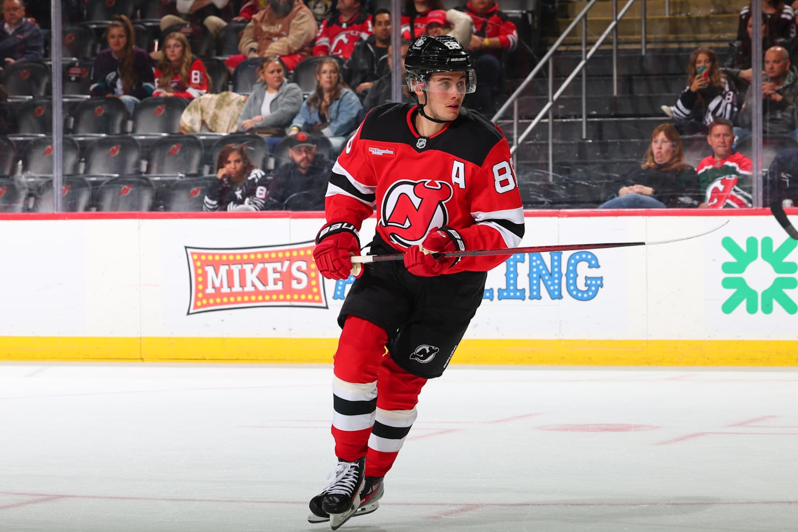 NEWARK, NJ - OCTOBER 27: Jack Hughes #86 of the New Jersey Devils skates in the third period of the game against the Anaheim Ducks at the Prudential Center on October 27, 2024 in Newark, New Jersey.  (Photo by Rich Graessle/NHLI via Getty Images)