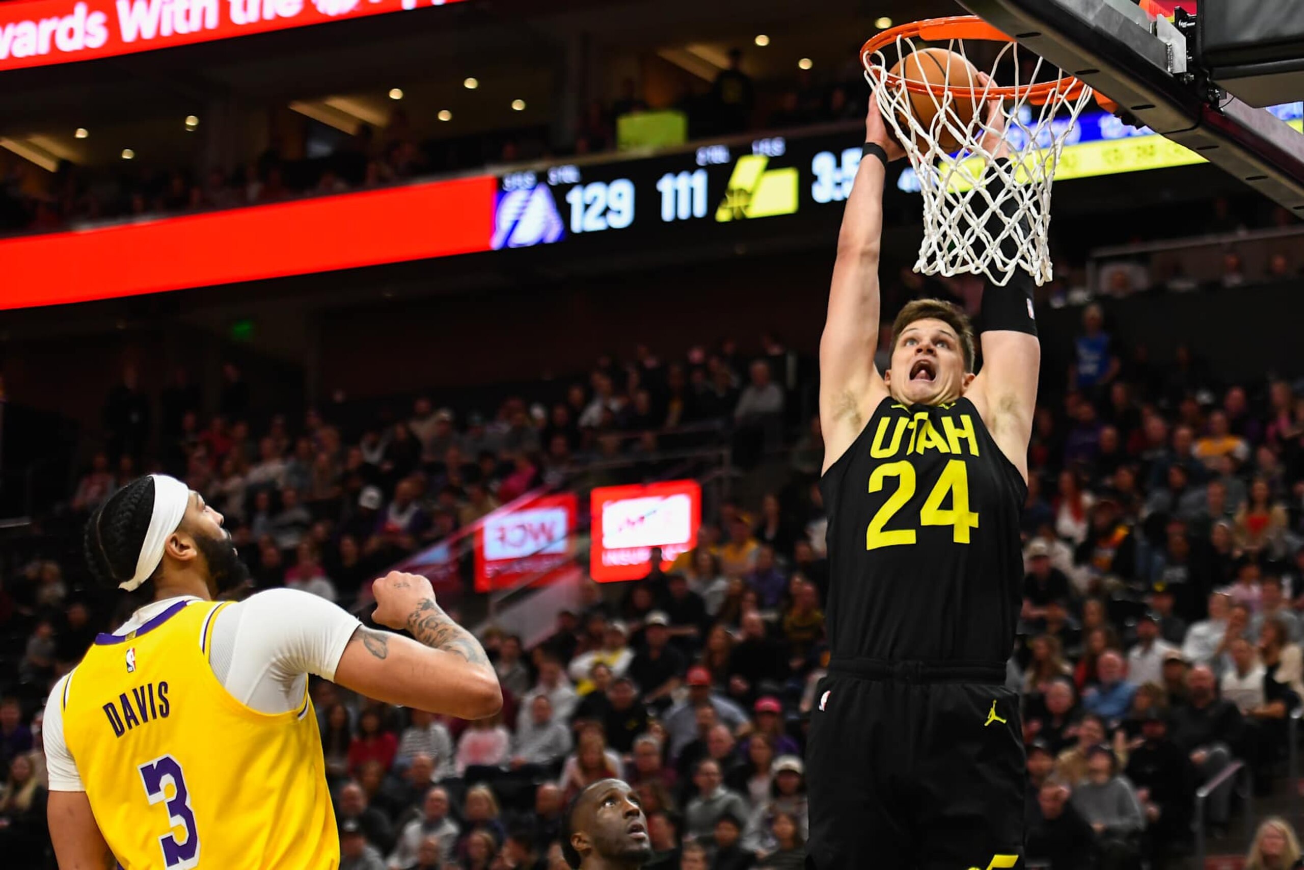 SALT LAKE CITY, UTAH - FEBRUARY 14: Walker Kessler #24 of the Utah Jazz dunks over Anthony Davis #3 and Taurean Prince #12 of the Los Angeles Lakers during the second half of a game at Delta Center on February 14, 2024 in Salt Lake City, Utah. NOTE TO USER: User expressly acknowledges and agrees that, by downloading and or using this photograph, User is consenting to the terms and conditions of the Getty Images License Agreement. (Photo by Alex Goodlett/Getty Images)