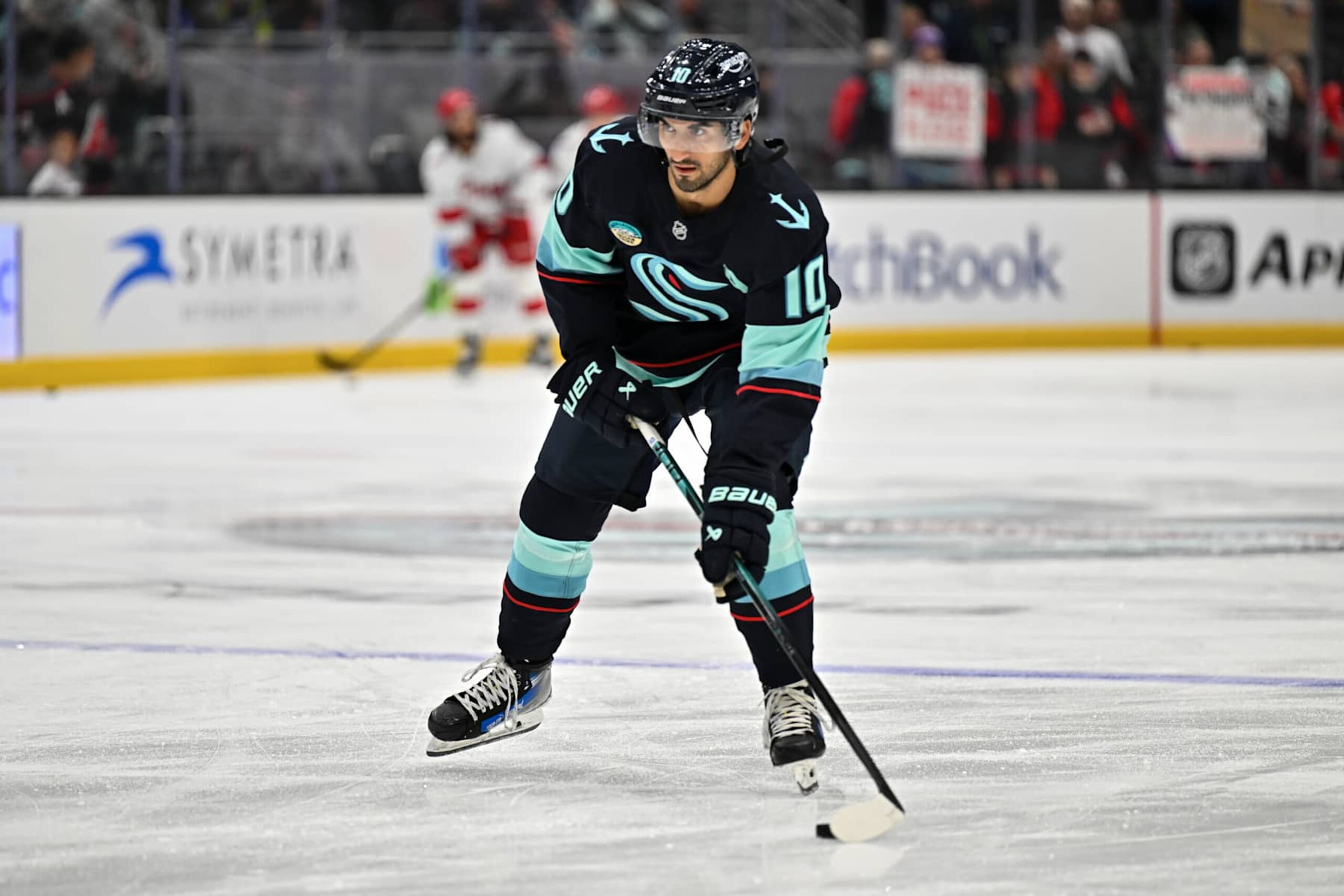 SEATTLE, WASHINGTON - OCTOBER 26: Matty Beniers #10 of the Seattle Kraken warmups before the game against the Carolina Hurricanes at Climate Pledge Arena on October 26, 2024 in Seattle, Washington. (Photo by Alika Jenner/Getty Images)