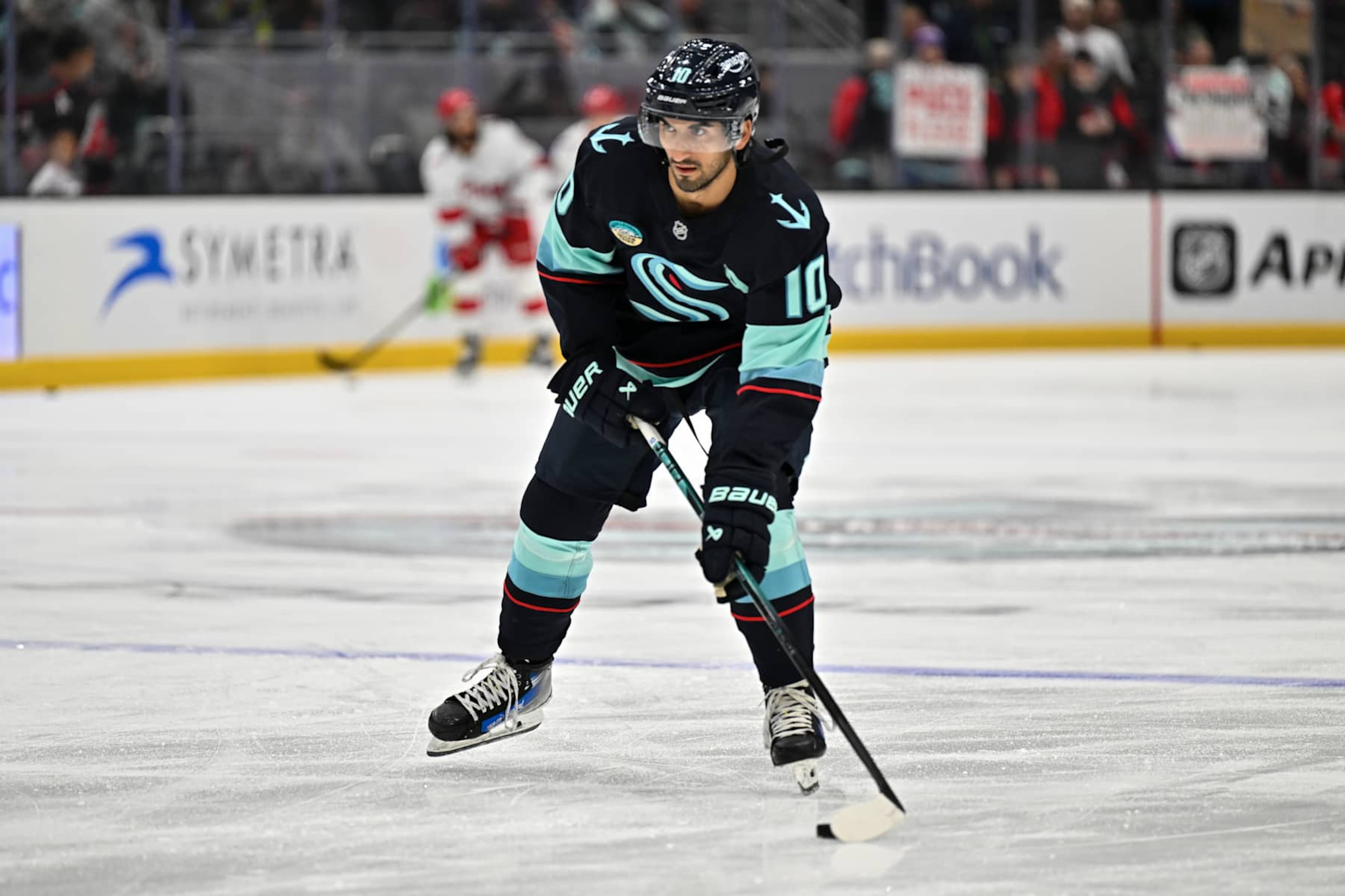 SEATTLE, WASHINGTON - OCTOBER 26: Matty Beniers #10 of the Seattle Kraken warmups before the game against the Carolina Hurricanes at Climate Pledge Arena on October 26, 2024 in Seattle, Washington. (Photo by Alika Jenner/Getty Images)