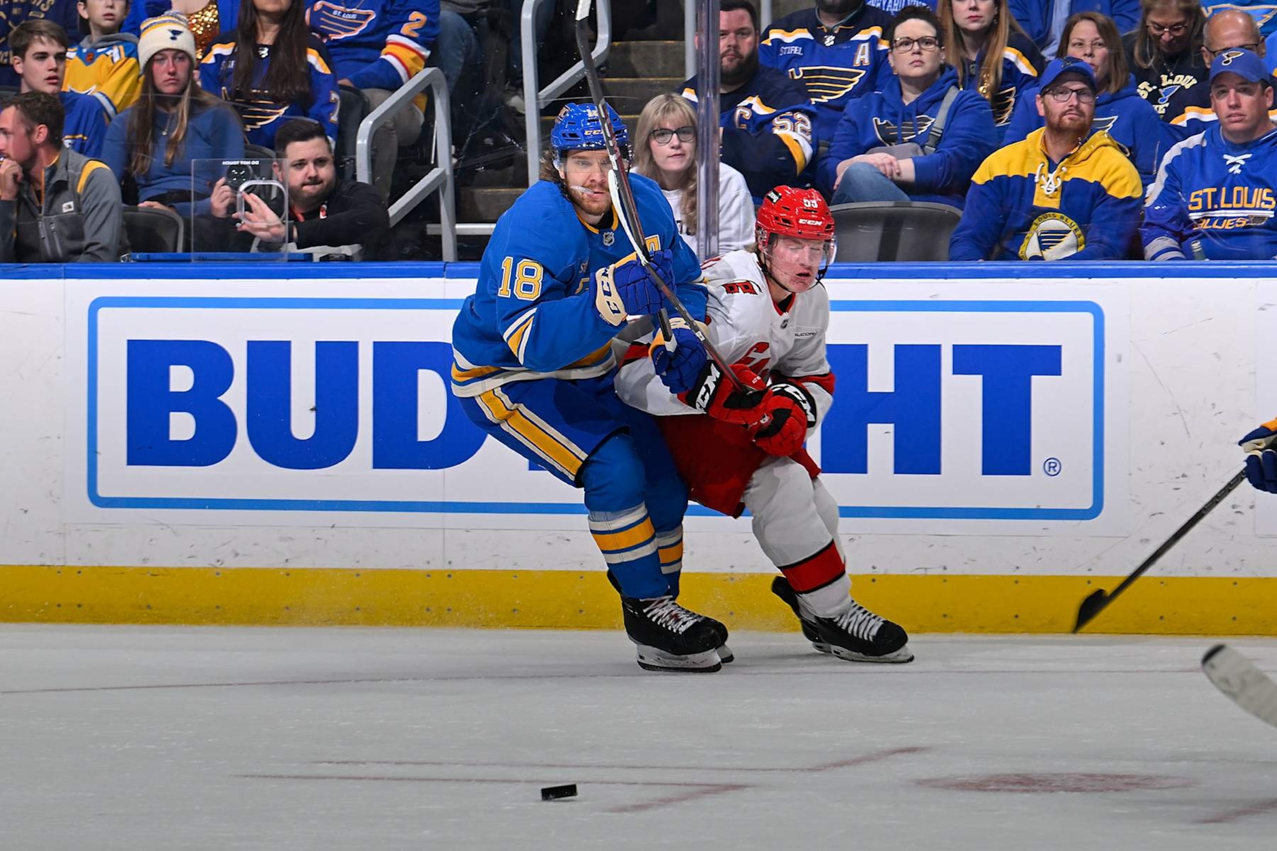 ST. LOUIS, MO - OCTOBER 15: Robert Thomas #18 of the St. Louis Blues defends against Jackson Blake #53 of the Carolina Hurricanes on October 15, 2024 at the Enterprise Center in St. Louis, Missouri. (Photo by Scott Rovak/NHLI via Getty Images)