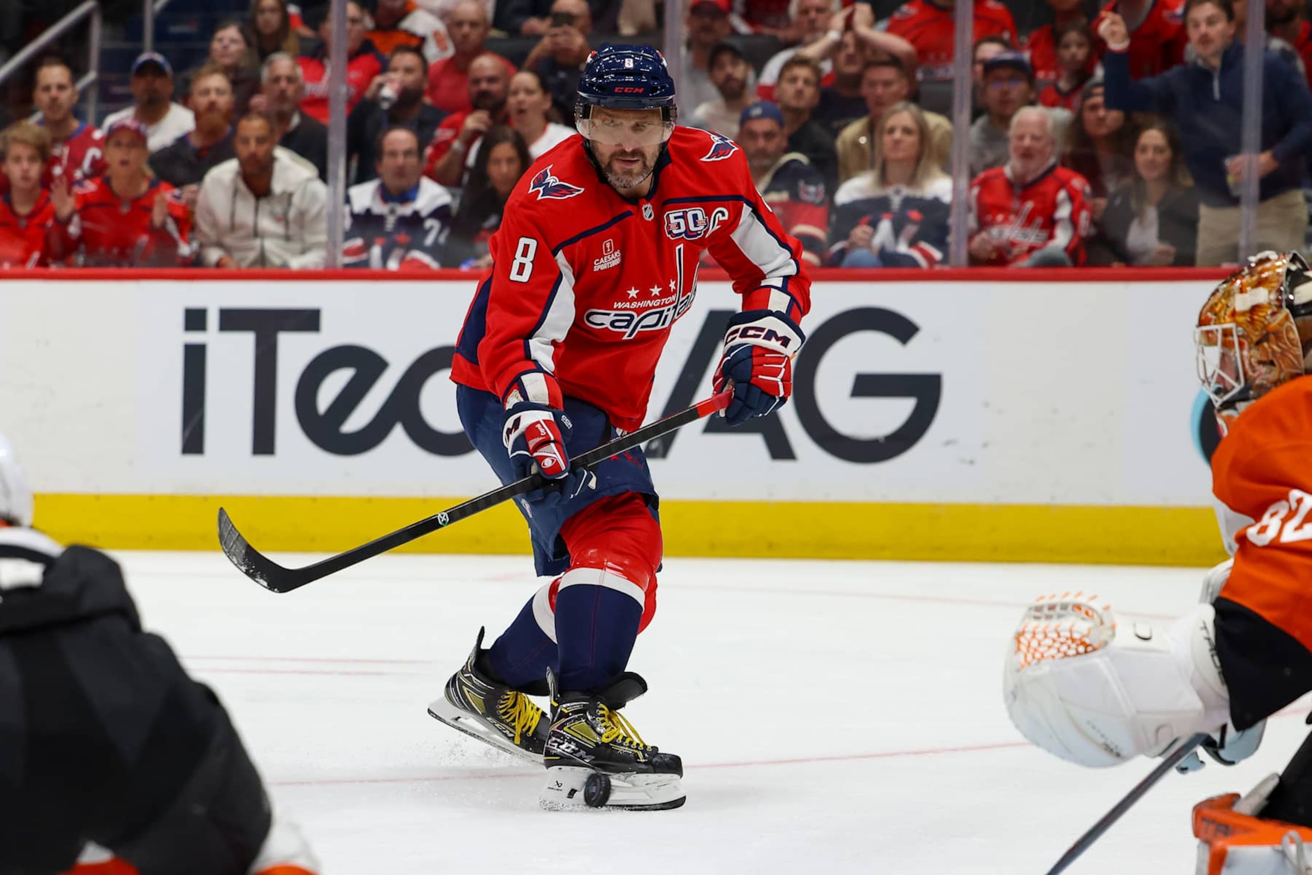 WASHINGTON, DC - OCTOBER 23: Alex Ovechkin #8 of the Washington Capitals has the puck hit his skate in front of the Philadelphia Flyers net during a game at Capital One Arena on October 23, 2024 in Washington, D.C. (Photo by John McCreary/NHLI via Getty Images)