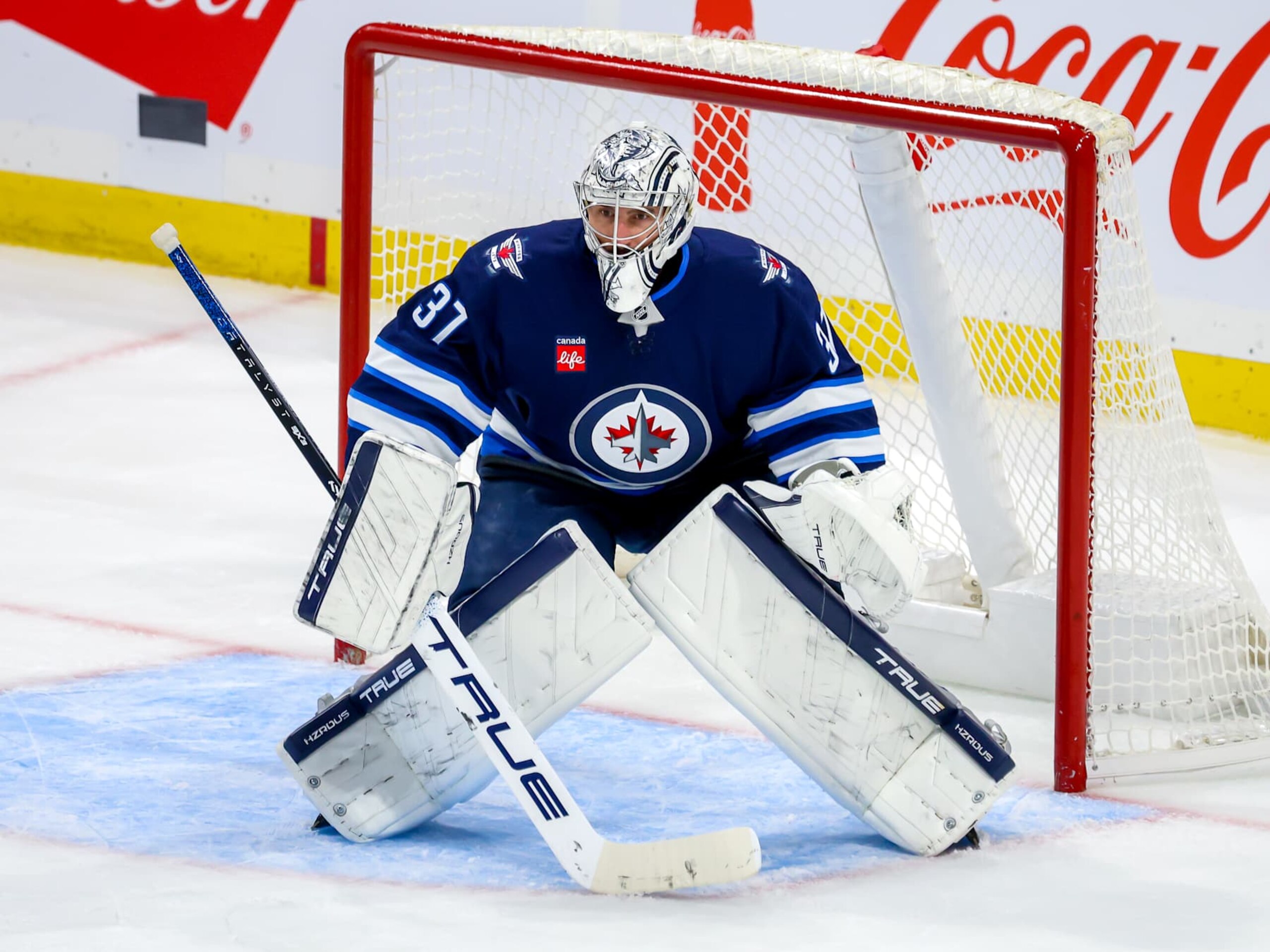 WINNIPEG, CANADA - OCTOBER 13: Goaltender Connor Hellebuyck #37 of the Winnipeg Jets guards the net during third period action against the Minnesota Wild at Canada Life Centre on October 13, 2024 in Winnipeg, Manitoba, Canada. (Photo by Jonathan Kozub/NHLI via Getty Images)