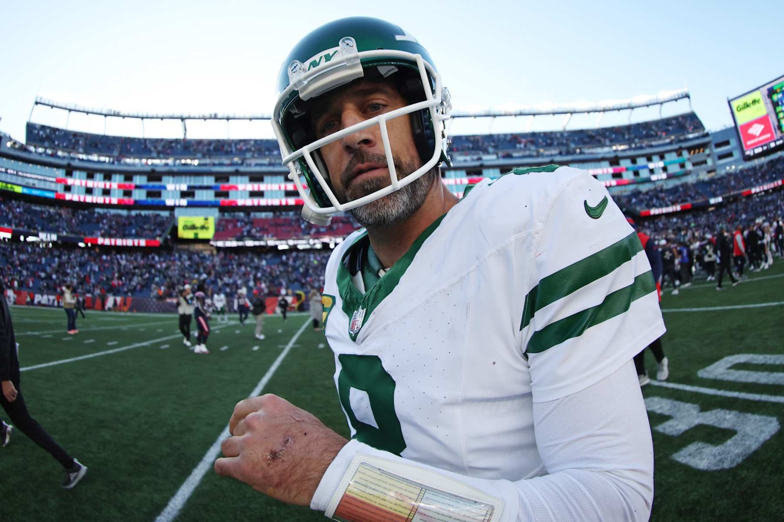 FOXBOROUGH, MASSACHUSETTS - OCTOBER 27: Aaron Rodgers #8 of the New York Jets walks off the field after the game against the New England Patriots at Gillette Stadium on October 27, 2024 in Foxborough, Massachusetts. (Photo by Adam Glanzman/Getty Images)